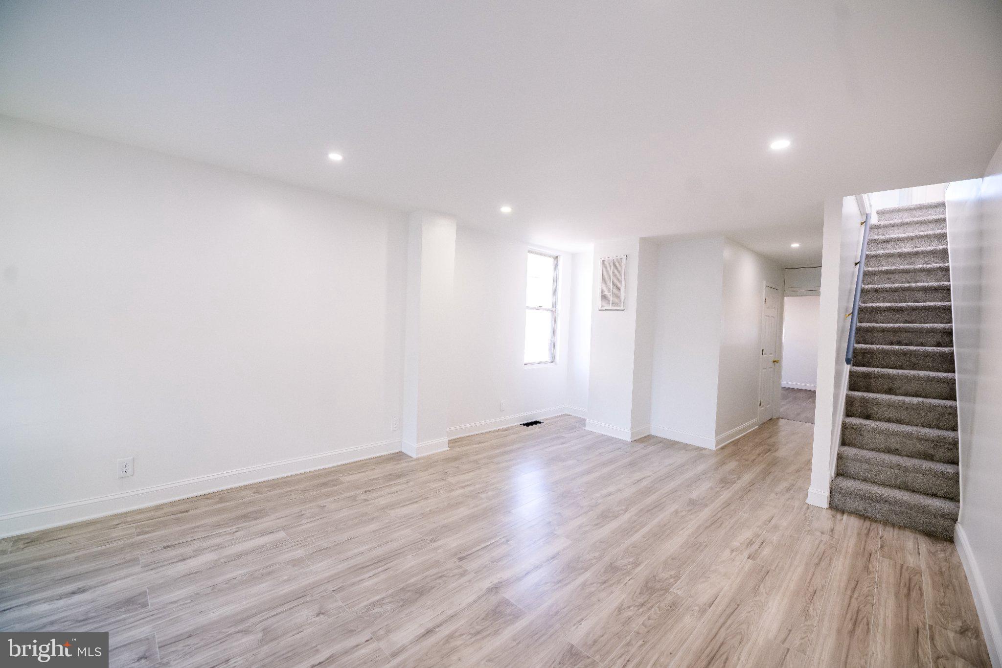 Rare Find! Updated 4 Bedroom/ 2 Bathroom End-of-Row Townhome with Incredible House-Hacking or Investment Potential. Whether you are a first-time homebuyer looking for a spacious home (or a smart way to offset your mortgage) or a savvy investor seeking a high-yield, low-maintenance property, this home is designed to maximize your ROI from day one. This home also comes equipped with a 2nd full kitchen in the basement! The fully finished lower level can act as its own self-contained living space, complete with a full kitchen, living area, full bath, and bedroom setup. The classic Baltimore skylight and upstairs windows bring in an enormous amount of natural light. This versatile do not stay on the market for long. Don't miss your chance to own a property that works for your future. Contact us today to schedule a private showing before it's gone!