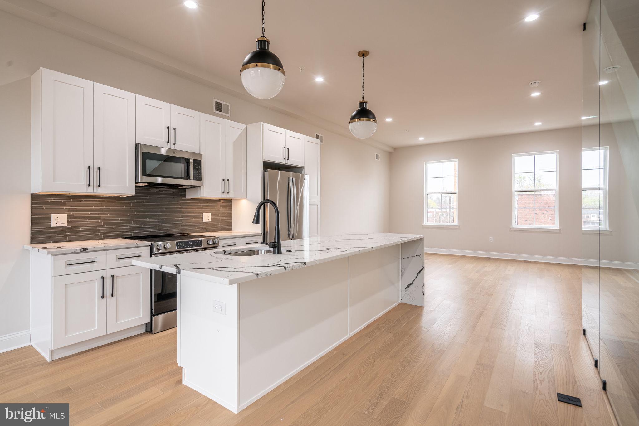 HOMEBUYER LOAN PROGRAM OFFERING 100% Financing, $5,000 LENDER CREDIT AND NO PMI.

Welcome to the epitome of urban living with a blend of modern luxury and financial savvy - 2721 Lorraine Court at Wynnefield Heights Square.   Fully approved 10-year tax abatement promises affordability, ensuring an attractive investment in your future. Spanning three generously appointed floors, this home boasts three exquisite bedrooms and three full bathrooms, catering to your need for space and privacy. The first floor introduces a seamless blend of utility and style, featuring a convenient bedroom and bathroom suite alongside a mechanical closet, further leading to a 1-car garage adorned with recessed lighting, a remote-operated overhead door, and a durable concrete floor - a rare find in city living. Ascend to the second floor where your culinary dreams come alive in a kitchen designed to impress. Manufactured quartz countertops complement an expansive island, setting the stage for memorable gatherings. GE stainless steel appliances, under-cabinet lighting, and 42" high wall cabinets elevate your cooking experience, while the engineered white oak flooring adds warmth and sophistication throughout. This level also hosts separate living and dining areas, with a balcony off the dining room inviting natural light and offering a glimpse of the neighborhood's vibrance. The third floor is a sanctuary of comfort, housing the master bedroom complete with essential amenities like dual closets and a master bathroom ·featuring a double vanity, frameless glass enclosure, and tiled finishes that evoke serenity. The additional bedroom mirrors this thoughtful design, ensuring comfort for all residents. Topping off this residence is a roof deck, a private retreat overlooking the cityscape, promising serene mornings and lively evenings under the Philadelphia sky. With every detail thoughtfully curated to enhance your lifestyle, 2721 Lorraine Ct isn't just a home; it's the cornerstone of your new chapter in Wynnefield Heights Square.  Fall 2026 Delivery