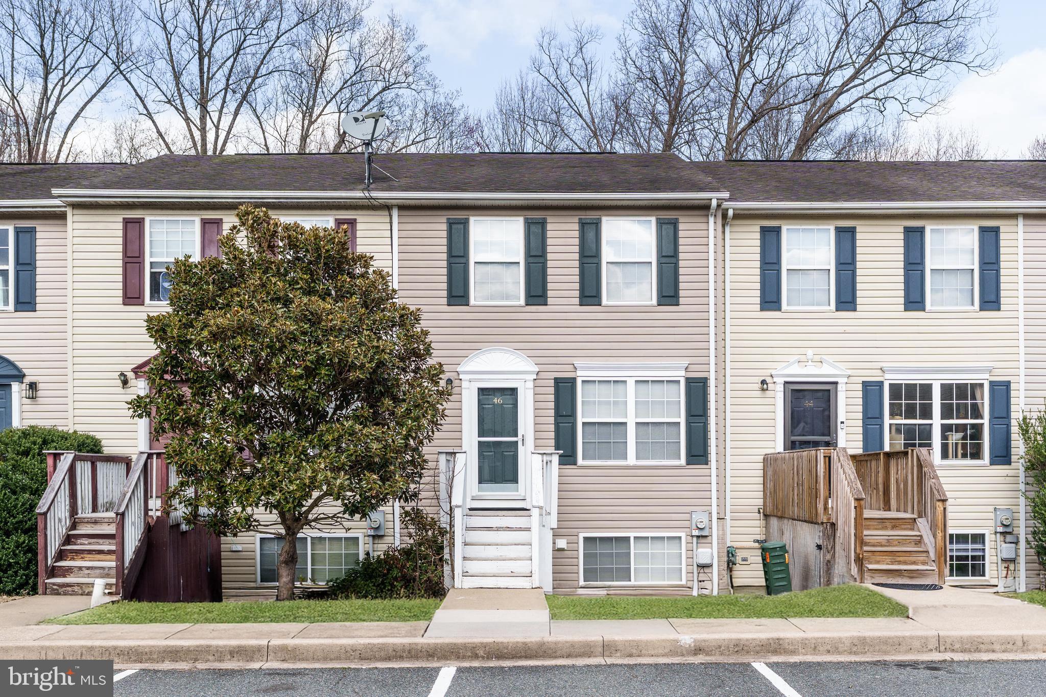 There's no place like home! Move-in ready three level townhome. Spacious, eat-in kitchen with ample cabinet and counter space. Enjoy spending summer evenings on either of your balconies or the back patio, all with tranquil views of the woods and creek. Upper level offers brand new carpet, two large bedrooms with direct access from the primary bedroom to the large bath with dual vanity, soaking tub and shower. Walk-out basement offers plenty of storage and could be finished for additional living space. Easy commute to major highways, local restaurants and marinas.