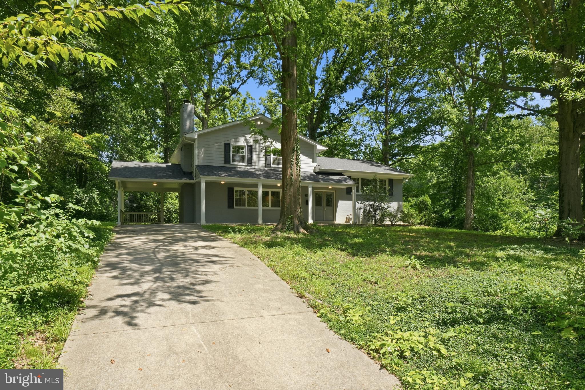 Step inside and discover a home where every detail has already been thoughtfully completed. Beautifully updated, impressively spacious with 2,290 total finished square feet, and filled with modern style, this four-level residence offers the rare feeling of moving into a nearly new home—without the wait.

Perfectly positioned on an oversized corner lot along a quiet cul-de-sac street, the home enjoys an expansive front yard and a peaceful, tree-lined setting. Despite its private feel, it remains just minutes from major commuter routes, shopping, dining, parks, and entertainment, delivering the ideal balance of serenity and everyday convenience.

Inside, rich dark hardwood flooring flows throughout the main and upper living spaces, complemented by beautifully updated lighting and a sophisticated, modern aesthetic. Two sets of stairs provide easy access between the upper and lower levels, while the distinctive split-level design creates four true floors of living space—offering far more room than expected.

The main level is bright, open, and immediately welcoming. A dramatic vaulted living room flows seamlessly into the dining area and showstopping gourmet-style kitchen. Quartz countertops, a classic subway tile backsplash, crisp white cabinetry, and stainless steel appliances create a timeless yet contemporary look. A large center island, accented by stylish pendant lighting, provides generous space for meal preparation, casual dining, and gathering with friends. Over the sink, a wide window frames peaceful views of the private, tree-lined backyard.

Upstairs, three generously sized bedrooms offer abundant natural light and ample closet space. The primary suite is complete with a beautifully renovated ensuite bath featuring a spacious vanity and oversized walk-in shower, while a second fully updated bathroom on this level serves the two additional bedrooms, continuing the home’s cohesive and polished design.

The first lower level expands the living space even further with walk-out access to the backyard. A large family room anchored by a wood-burning fireplace creates the perfect setting for cozy evenings, movie nights, or relaxed entertaining. This level also includes a spacious fourth bedroom and a third beautifully updated full bathroom, making it ideal for guests, multigenerational living, or a private home office suite.

The second lower level offers a substantial unfinished space with windows and endless potential. Currently ideal for exceptional storage, it could easily be transformed into a game room, home theater, fitness studio, workshop, or additional entertainment space.

With its extensive updates, flexible four-level layout, remarkable amount of space, and rare assumable 2.5% VA loan, this home delivers style, comfort, and value in one exceptional package. Simply move in, unpack, and begin enjoying a home that already feels completely renewed.