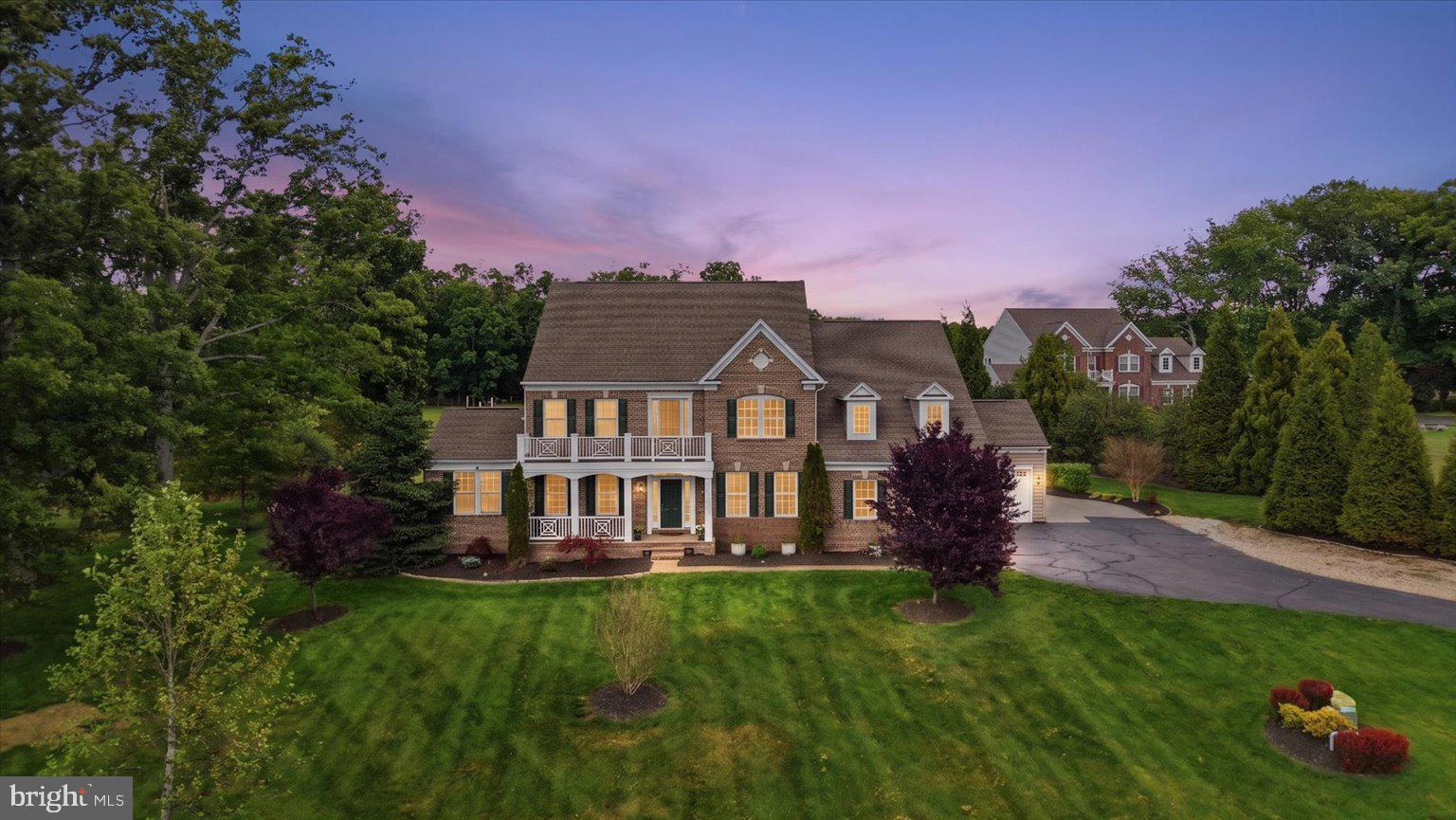 Welcome to this spectacular custom estate tucked within the prestigious Huntleigh at Creighton Farms community, where luxury, privacy, and modern functionality converge on over 4 breathtaking acres surrounded by mature trees and expansive green space. Offering more than 7,200 square feet across four beautifully finished levels, this exceptional residence has been extensively upgraded with over $250,000 in recent improvements, creating a home that lives and feels like a newly customized luxury estate while offering the warmth, elegance, and flexibility today’s luxury buyers desire.

Featuring 7 spacious bedrooms and 6.5 baths thoughtfully distributed across all four finished levels, this extraordinary home was intentionally designed for multigenerational living, long-term guests, au pair accommodations, or evolving family needs. Highlights include a main-level in-law suite with handicap-accessible doorways and private comfort features, a private fourth-level bonus retreat with separate HVAC system, and expansive living areas that provide both privacy and connection throughout the home.

The beautifully remodeled 2025 gourmet kitchen serves as the heart of the home, showcasing stunning countertops and backsplashes, custom cabinetry, oversized center island, designer coffee bar, and newly installed luxury Sub-Zero refrigerator and Wolf gas cooktop. The sun-filled breakfast room overlooks the beautifully landscaped grounds, while elegant entertaining spaces include a formal dining room with butler’s pantry, expansive family and living areas, a striking stone gas fireplace, and walls of windows that flood the home with natural light and picturesque views.

The luxurious owner’s suite offers a true private retreat with a spa-inspired bath and dual walk-in closets, while the upper level also features generously sized secondary bedrooms and a spacious laundry room with additional storage. Bathrooms throughout the home have been tastefully upgraded with quartz-top vanities, modern fixtures and mirrors, beautiful new tile work, updated porcelain flooring, fresh paint, updated lighting and fixtures, and premium Karastan high-traffic carpet throughout.

The walk-up lower level offers exceptional flexibility for modern luxury living and features expansive recreation and media areas, exercise and hobby rooms, abundant storage, and a brand-new grand full second kitchen — ideal for multigenerational living, private guest quarters, extended stays, or elevated entertaining.

Step outside to your own private resort featuring over $150,000 in thoughtfully curated landscaping and hardscaping improvements, including more than 3,000 square feet of custom patio space, a fire pit lounge, oversized hot tub, sprinkler system with booster pump, permeable parking extension, newly sealed asphalt driveway, and beautifully designed outdoor gathering areas perfect for entertaining, relaxing evenings under the stars, or enjoying the peaceful natural surroundings.

Additional luxury and infrastructure improvements include full-home spray foam insulation, whole-house RainSoft water filtration and softener system, upgraded electrical power in the garage and basement, an owned 1,000-gallon propane tank, and a whole-house Generac generator for added peace of mind. The home also benefits from multiple HVAC systems, including separate climate control servicing the in-law suite and upper-level bonus retreat, providing enhanced comfort and efficiency throughout. The main HVAC servicing the basement, main level, and upper floor was upgraded to the Performance Series in 2021, while all HVAC systems and heat pumps were professionally serviced in 2025.

The oversized 3-car garage, extended parking areas, and extensive recent improvements further elevate this exceptional offering.

A rare opportunity to own an extensively upgraded luxury estate offering timeless elegance, modern infrastructure, multigenerational flexibility, and resort-style living just minutes from