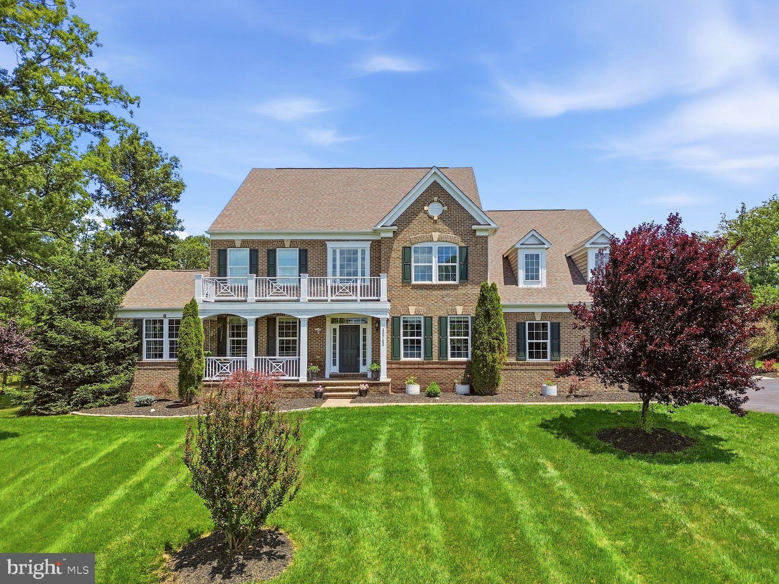 Welcome to this spectacular custom estate tucked within the prestigious Huntleigh at Creighton Farms community, where luxury, privacy, and modern functionality converge on over 4 breathtaking acres surrounded by mature trees and expansive green space. Offering more than 7,200 square feet across four beautifully finished levels, this exceptional residence has been extensively upgraded with over $250,000 in recent improvements, creating a home that lives and feels like a newly customized luxury estate while offering the warmth, elegance, and flexibility today’s luxury buyers desire.

Featuring 7 spacious bedrooms and 6.5 baths thoughtfully distributed across all four finished levels, this extraordinary home was intentionally designed for multigenerational living, long-term guests, au pair accommodations, or evolving family needs. Highlights include a main-level in-law suite with handicap-accessible doorways and private comfort features, a private fourth-level bonus retreat with separate HVAC system, and expansive living areas that provide both privacy and connection throughout the home.

The beautifully remodeled 2025 gourmet kitchen serves as the heart of the home, showcasing stunning countertops and backsplashes, custom cabinetry, oversized center island, designer coffee bar, and newly installed luxury Sub-Zero refrigerator and Wolf gas cooktop. The sun-filled breakfast room overlooks the beautifully landscaped grounds, while elegant entertaining spaces include a formal dining room with butler’s pantry, expansive family and living areas, a striking stone gas fireplace, and walls of windows that flood the home with natural light and picturesque views.

The luxurious owner’s suite offers a true private retreat with a spa-inspired bath and dual walk-in closets, while the upper level also features generously sized secondary bedrooms and a spacious laundry room with additional storage. Bathrooms throughout the home have been tastefully upgraded with quartz-top vanities, modern fixtures and mirrors, beautiful new tile work, updated porcelain flooring, fresh paint, updated lighting and fixtures, and premium Karastan high-traffic carpet throughout.

The walk-up lower level offers exceptional flexibility for modern luxury living and features expansive recreation and media areas, exercise and hobby rooms, abundant storage, and a brand-new grand full second kitchen — ideal for multigenerational living, private guest quarters, extended stays, or elevated entertaining.

Step outside to your own private resort featuring over $150,000 in thoughtfully curated landscaping and hardscaping improvements, including more than 3,000 square feet of custom patio space, a fire pit lounge, oversized hot tub, sprinkler system with booster pump, permeable parking extension, newly sealed asphalt driveway, and beautifully designed outdoor gathering areas perfect for entertaining, relaxing evenings under the stars, or enjoying the peaceful natural surroundings.

Additional luxury and infrastructure improvements include full-home spray foam insulation, whole-house RainSoft water filtration and softener system, upgraded electrical power in the garage and basement, an owned 1,000-gallon propane tank, and a whole-house Generac generator for added peace of mind. The home also benefits from multiple HVAC systems, including separate climate control servicing the in-law suite and upper-level bonus retreat, providing enhanced comfort and efficiency throughout. The main HVAC servicing the basement, main level, and upper floor was upgraded to the Performance Series in 2021, while all HVAC systems and heat pumps were professionally serviced in 2025.

The oversized 3-car garage, extended parking areas, and extensive recent improvements further elevate this exceptional offering.

A rare opportunity to own an extensively upgraded luxury estate offering timeless elegance, modern infrastructure, multigenerational flexibility, and resort-style living just minutes from