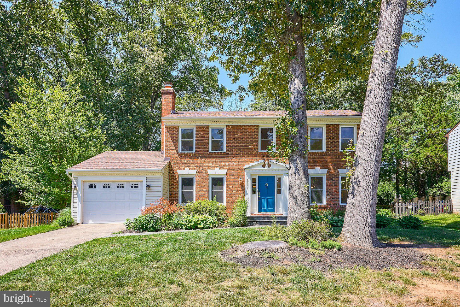 Welcome to 5631 Fort Corloran Drive, a beautifully maintained brick-front colonial tucked away on a quiet cul-de-sac in Burke's sought-after Signal Hill community. Offering 4 bedrooms, 2.5 baths, and a long list of thoughtful updates, this home perfectly blends timeless charm with modern convenience.

Inside, Brazilian cherry hardwood floors span the main level, creating a warm and inviting atmosphere throughout the home's spacious living areas. The main level offers two separate gathering spaces, including a cozy family room anchored by a wood-burning fireplace—perfect for relaxing evenings at home. The updated kitchen features granite countertops, a tile backsplash, stainless steel appliances, and ceramic tile flooring, while the adjoining conditioned sunroom provides a light-filled retreat overlooking the private, fully fenced backyard.

Additional main-level conveniences include a half bath and a functional laundry/mudroom with built-in storage and direct access to the attached one-car garage, making everyday living both practical and efficient.

Upstairs, the spacious primary suite has been thoughtfully reconfigured to create a luxurious private retreat. The renovated en-suite bath features a large glass-enclosed shower, double vanity, heated tile floors, and quality finishes throughout. A custom walk-in closet system provides exceptional storage and organization. Three additional bedrooms and a beautifully renovated hall bath complete the upper level.

The finished portion of the lower level offers a generous recreation room highlighted by custom reclaimed-wood built-in shelving, providing the perfect space for entertaining, hobbies, or movie nights. The unfinished area offers abundant storage space and convenient exterior access.

The improvements reflect true pride of ownership and should provide the new Owners peace of mind for years to come. Notable updates include a new HVAC system (2025), blown-in attic insulation (2018), renovated bathrooms, rebuilt staircases, fresh interior paint, and numerous additional enhancements throughout the home. 

The attached one-car garage provides protected parking from the elements and offers valuable additional storage space, with easy access to both the mudroom and the backyard.

Conveniently located approximately one mile from the Burke Center VRE station and just minutes from shopping, dining, parks, trails, and major commuter routes, this is a rare opportunity to own a truly move-in-ready home in one of Burke's most desirable neighborhoods.