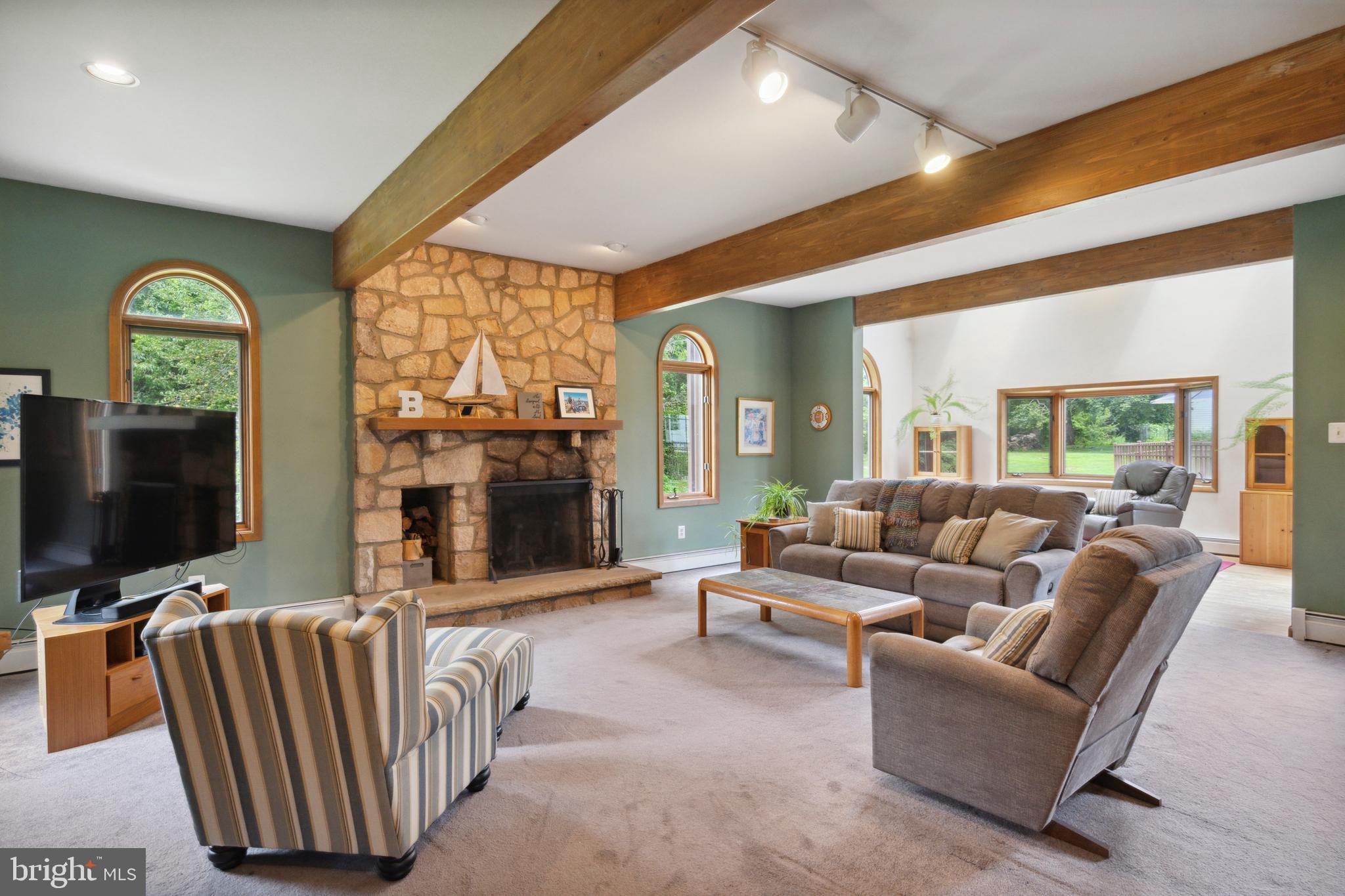 Set Sail for your Dream Property! This Soaring Contemporary 5BR 2.5B Custom-Built Estate (1982/1993c. Addition) includes a separate charming, newly re-built 2 BR, 1B single-story Cottage, a terraced Pool, and Garages offering Parking for Four+++.  Surrounded by picturesque Pennsylvania landscapes, abutting idyllic horse trails, and set amongst an architectural showcase along Johnson Road- this rare and wonderful Plymouth Meeting property is available now after 7+ decades of impeccable stewardship by a treasured local family. Thoughtful design has been professionally executed to maximize today's needs for live, work, and play spaces. Whether providing maximum flexibility for a growing multi-generational brood; or serving your varied vocational/ avocational interests; perhaps allowing for passive rental income...this stunning, two-structure 'Compound' delivers! Choose from not just one but two separate Driveways to enter this lush property. The thrilling, warm-wooded Exterior of the Mainhouse- Modern yet timeless- has just been expertly re-stored for its next new owners. Additionally, the Interior of the freshly white-washed adjacent Cottage (1945c.)  has been completely re-built- stripped to studs, and now to a finished, beautifully re-designed floorplan... reflecting today's exacting standards with open ease. A glamorous Pool House? An Artist's Retreat; or expanded first-level living for loved ones? OR, a separate fully contained 2BR, 1B Rental (new Washer & Dryer incl.),  w/ Central AC and an attached 2 Car Garage...? Our dynamic and ever-changing lifestyles need wonderful options such as these... Glorious Parking is abundant at 1911 Johnson Rd.! Pulling up to the Main House you encounter richly-stained, quality-constructed additional Parking Bays offering civilized inside access. The Home's Great Room is heart-skipping, with its impactful honey-hued Oak-beamed masts above, grounding stone wood-burning Fireplace focal point, and adjacent skylit Atrium with views to the Pool beyond. Arch-shaped picture windows abound- each pretty as a picture framed with unpainted Oak, highlighting your own gorgeous green and private World beyond...A step up to the Kitchen allows for a fantastic perch- never too far from the ebb and flow - yet still tucked away, as needed. Dine in an intimate setting, or choose to lay out a grand banquet anywhere throughout the versatile 1st level. The lower level is vast and excites the imagination with room to make your own- Wine Cellar, Media Room, high-ceilinged Workshop? Have a go! Serenely Carpeted underfoot- ascend either of Two staircases to connect with the 5 Bedroom options above. Playfully shaped light-filled rooms combine with peaceful traditional bedrooms. A Primary Suite delights- containing a Sitting Room with Fireplace, Walk-in Closets, a Spiral Staircase with a Balcony view from the sleeping Loft above. Also, makes for a wonderful bi-level Family Room for all to enjoy-perhaps. Just freshly skim-coated and painted throughout the house, where required- there are still fantastic opportunities to add your own decorator's touch. Along with the Video Tour, use the convenient 3D Mattersport provided to start imagining your projects to be...