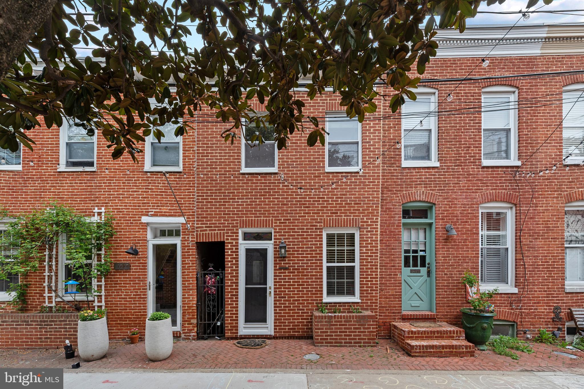 Welcome home! This charming and cozy  home sits on a quiet court in  Federal Hill's historic district. Rest assured you will feel safe and secure as this home is tucked away with no pass through traffic. Street string lights add illumination and ambiance at night! Minutes from M&T Bank Stadium & Camden Yards! With 2 bedrooms and 1 full bath, this adorable home features a large, newer deck, gas stove, hardwood floors, and newer HVAC (2016). Move right in, and start enjoying all the culture, dining and entertaining that Federal Hill has to offer!