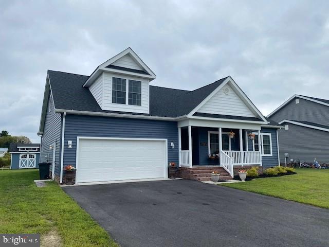This is the home you have been waiting for.  Perfectly located in the Woodland Manor Community of Pocomoke.  Close to local schools, restaurants, and shopping.  Includes four bedrooms and two full bathrooms.  Open floorplan kitchen, living room, and dining room.  Lots of high end features...such as granite counter tops, luxury VP flooring, and stainless steel appliances.  Upstairs includes the four bedroom that is great for an office or as an additional room for sleeping.  Large walk in attic space has plenty of room for storage.  Located on a small pond which often gets visited by local wildlife.  Paved driveway and cute little shed on site.  Two car attached garage in addition to the driveway.  Community has sidewalks for your convince.  Located approx. 30 minutes from NASA/Wallops Flight Facility.  Not much further to Chincoteague and Assateague Island, Va.  Also about 30 minutes to other great destinations such as Ocean City to the northeast and Salisbury to the north.  Great location with lots of options close by.  Home was new in 2021 but has been gently lived in.