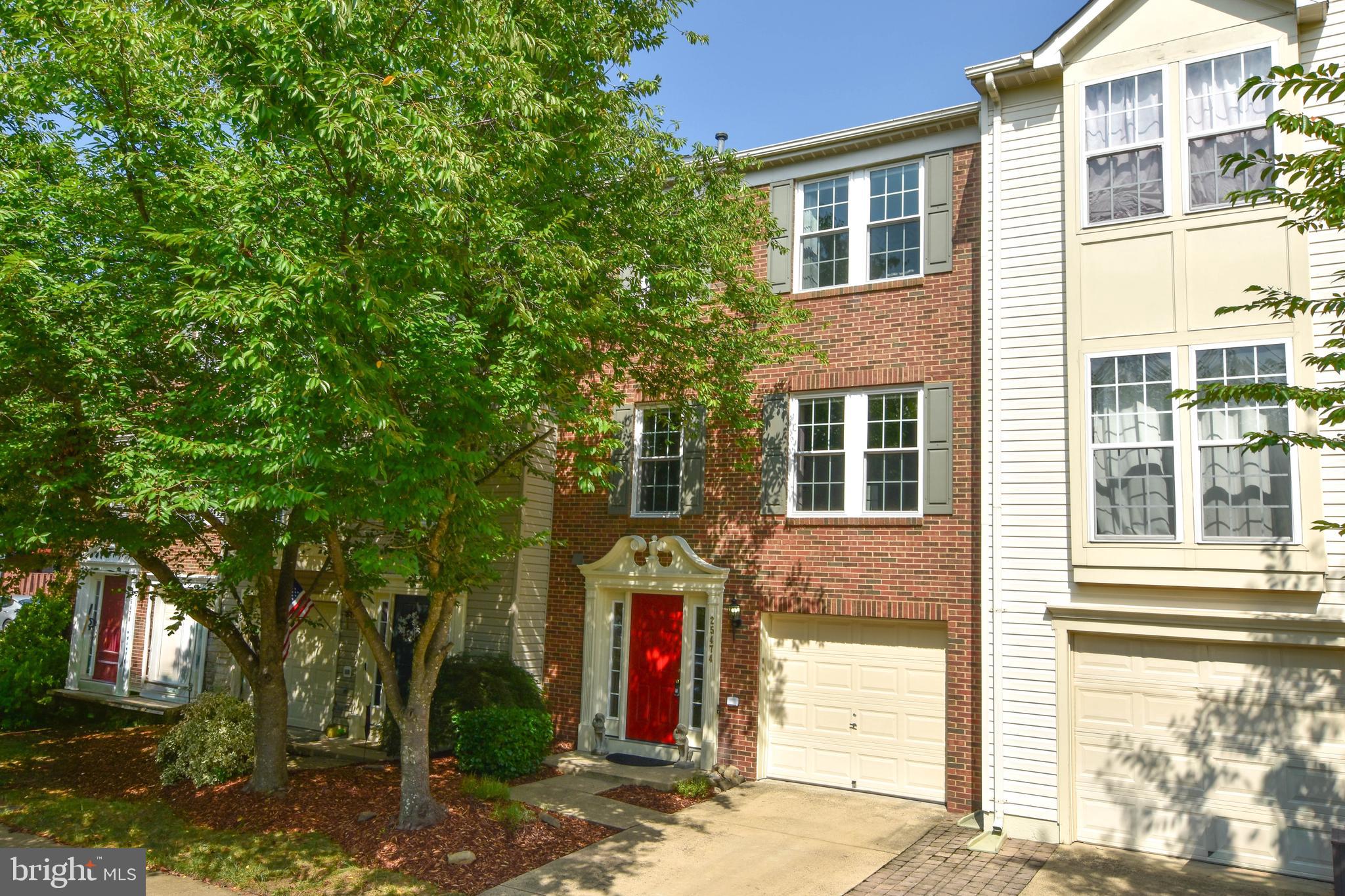 The pride of home ownership is exemplified by the attention paid to detail in this lovely townhome. The owner has improved every feature imaginable including a beautiful hardscaped yard with a swing designed to relax in your private oasis. Some additional benefits to this property are no grass to mow in back and a gas hook up on the deck to cook on the grill or to use for heat on chilly evenings. There are gorgeous beautifully maintained hardwood floors on the main level. The living room has custom built in book shelves. You can enjoy the fire in the family room with a custom fireplace mantel and surround. There is brand new carpet on the upper level. The location is fabulous in sought after South Riding and has additional oversized parking in front and green areas surrounding the house. This is a premium lot. 
Features/ updates include:
Primary bath was remodeled in 2021 with a tall vanity, power for a bidet, an upgraded exhaust fan and a timed outlet.
The primary bedroom has two custom closets.
The hall bath has been remodeled with a tall vanity, new tub and upgraded exhaust fan.
The upper level has new carpet 2026.
The Pro Via entry door and front windows were installed in 2026.
The new large Trex deck was installed in 2025.
The roof and attic fan were replaced in 2018.
A new dishwasher was installed in 2026.
A new A/C was installed in 2010 with the whole house humidifier with air filtration at three returns.
A new water heater, expansion tank and pressure regulation was installed in 2016.
New quartz kitchen counters and new sink were installed in 2015.
New hardwood floors were installed in 2011 on the main level.
The basement walks out to a beautiful oasis with a paver patio.
The townhome has a three level bump out which extends the living space on all three levels. 
Enjoy a premium location just minutes from shopping, dining, grocery stores, healthcare, Dulles Airport, and fitness centers—plus South Riding’s amenities: community recreation center, walking trails, four pools, clubhouse, playgrounds, picnic areas, and green spaces.