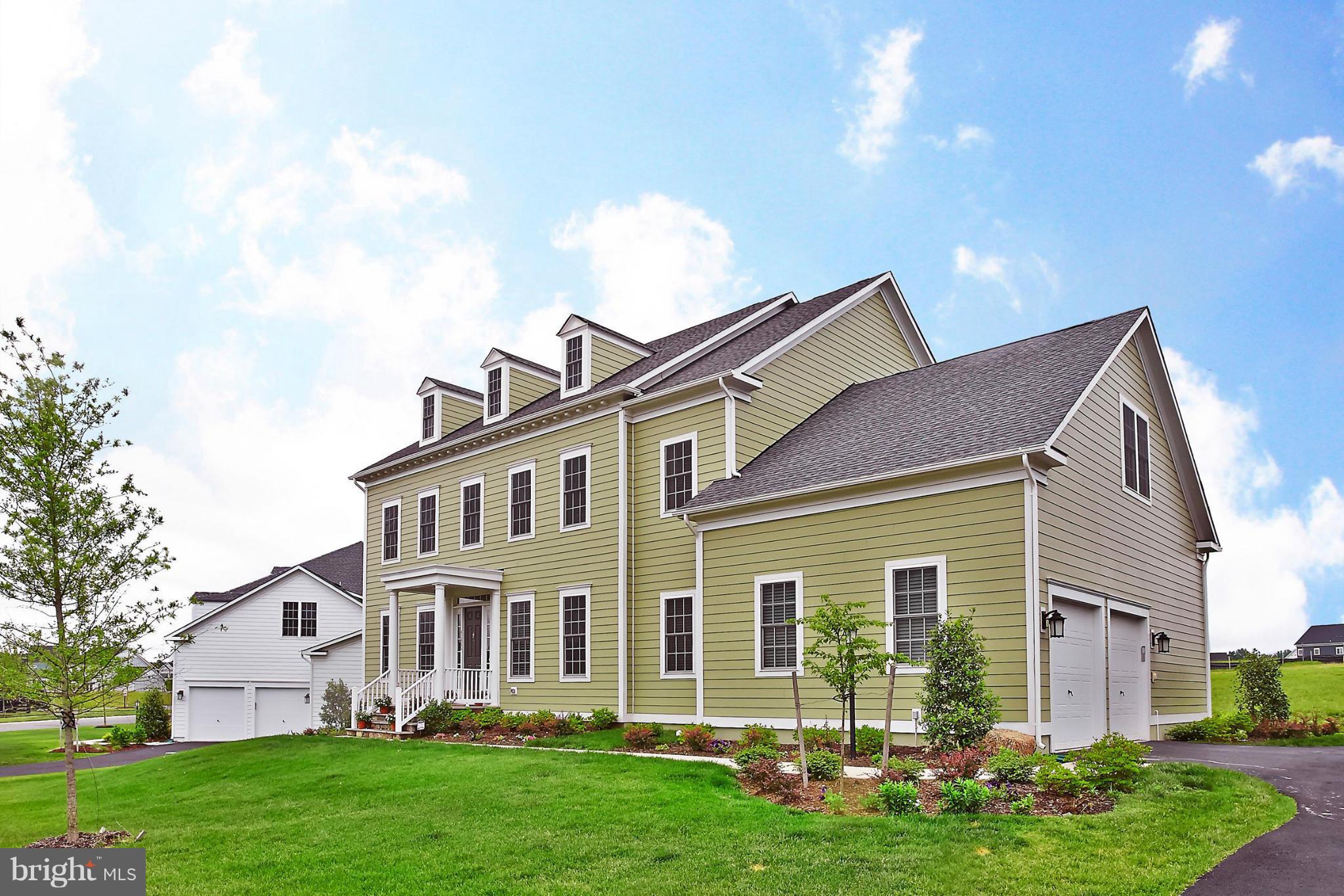 6,400 sq.ft. of stunning living space w/incredible upgrades throughout * Gleaming HW s * Front & Rear Foyers * FamRm w/soaring 2 story ceilings & floor to ceiling masonry gas fpl * Gourmet Kit w/granite & ss apps * Den/Study w/custom clsts * MudRm w/built-ins * Grand Master w/SitRm, walk-in clst, En-Suite Bath w/soak tub & sep shower * Fin walkout LL w/RecRm, wetbar rough-in, Bdrm & full Bath