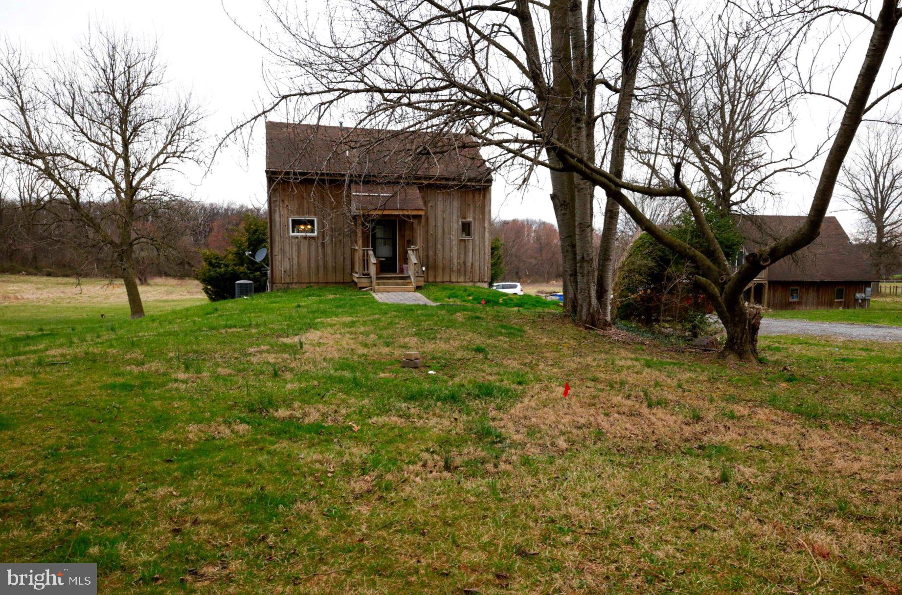 An exceptional investment or multi-generational opportunity, 25 Keller Road sits on 5.6 pristine acres in the heart of Cochranville’s equestrian country. This unique property features three distinct, income-generating residences along with a 5 stall barn, offering a rare blend of rural charm and proven rental utility.
The Main Residence is a beautiful home with 2 Bedrooms, 2 full bathrooms and a powder room, a modern kitchen, new flooring(2025), and an efficient heat pump. Just steps away, a Detached Two-Car Garage houses a One-Bedroom In-Law Apartment above, perfect for a long-term tenant or guest suite. Adding further value, the property includes a third rental unit a studio barn apartment. Beyond the residences, the acreage is ready to meet your Equestrian Facility needs, featuring:
A 5-Stall Barn equipped with a wash stall and heated tack room. Lush pastures, including a run-in shed with 2 additional stalls, 50' round lunging corral.
Whether you are looking to add a high-yield asset to your portfolio or seeking a primary residence that pays for itself, this property offers immediate cash flow and endless potential in a scenic, sought-after location.