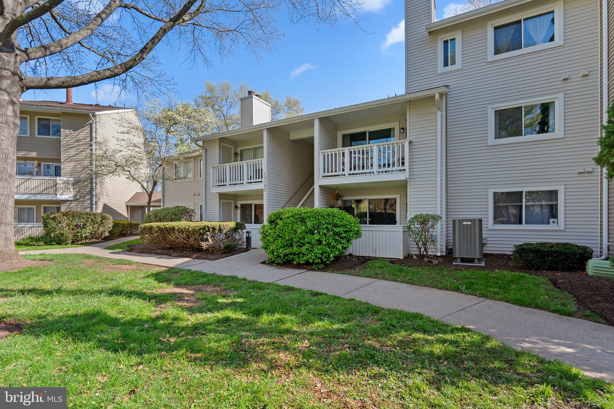 LOOKING FOR A HOME THAT HAS BEEN LOVED BY THE OWNER  AND JUST "FEELS LIKE HOME" FROM THE MOMENT YOU WALK IN? THIS IS THAT OPPORTUNITY!  LOCATED IN NORTHWEST HS DISTRICT! This wonderful, first-floor 2 bedroom/2 bathroom condo is in an ideal location in a courtyard. This home has been lightly lived in and meticulously cared for, not an easy thing to find! Enter this freshly painted, tastefully decorated home and you are immediately greeted by the beautiful LVP flooring (2022) and open floor plan. The kitchen features updated dishwasher & fridge (2020), brand new disposal and lots of counter and cabinet space. The dining area is conveniently located right next to the kitchen and has had chair railing recently installed, The family room is immediately off the kitchen and features a wood-burning fireplace, and slider opening up to private patio. Large primary bedroom with bathroom, secondary bedroom is good size as well.  Washer and dryer were installed in 2020.  AMENITY-RICH NEIGHBORHOOD featuring community pool, sauna, fitness center, playground, basketball court and nearby parks & walking trails.  PARKING features 1 assigned spot plus extra permit to park in unreserved spots. GREAT GERMANTOWN LOCATION, close to grocery stores, shopping, parks and restaurants. Close to I-270 and other commuter routes. Germantown MARC station is only 5 minutes away, Shady Grove Metro is a short 15-minute ride.