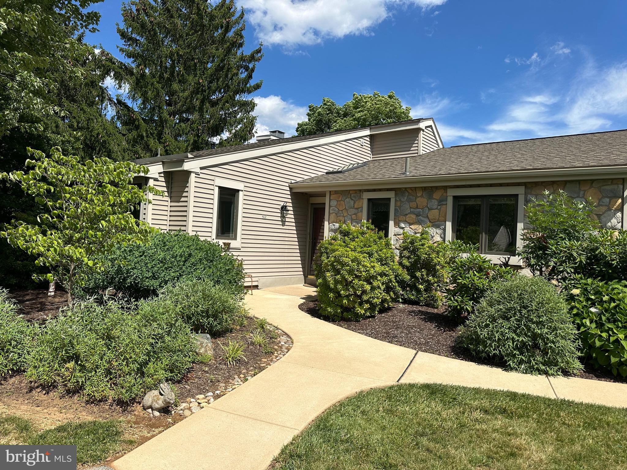 Welcome to Hershey’s Mill, one of Chester County’s most sought-after 55+ gated communities! This beautifully maintained end-unit Donegal model offers the perfect combination of comfort, space, and breathtaking golf course views.
Featuring 2 bedrooms, 2.5 baths, and a bright, open floor plan filled with natural light, this home has been thoughtfully updated and tastefully decorated throughout. Hardwood flooring flows throughout the main level, creating a warm and inviting atmosphere. The spacious living and dining areas overlook stunning fairway views and provide the ideal setting for both everyday living and entertaining.
The finished lower level adds tremendous flexibility with a large recreation area, powder room, abundant storage space, and endless possibilities for a home office, hobby room, fitness area, or guest overflow. A detached one-car garage and convenient parking directly in front of the home make hosting family and friends effortless.
Outside, enjoy professionally designed landscaping with gorgeous custom plantings that provide color and beauty throughout the seasons. Relax on your private outdoor space while taking in picturesque golf course vistas.
Life at Hershey’s Mill is about much more than the home itself. Residents enjoy an unparalleled resort-style lifestyle featuring miles of scenic walking trails, a community pool and pool house, tennis courts, pickleball, bocce, shuffleboard, community gardens, a dog park, woodworking workshop, and a vibrant community center offering countless clubs, activities, social events & 30+ clubs to join.
Whether you're seeking an active lifestyle, low-maintenance living, or a welcoming community filled with amenities, this exceptional home offers it all. Don't miss the opportunity to experience one of Chester County's premier active adult communities.