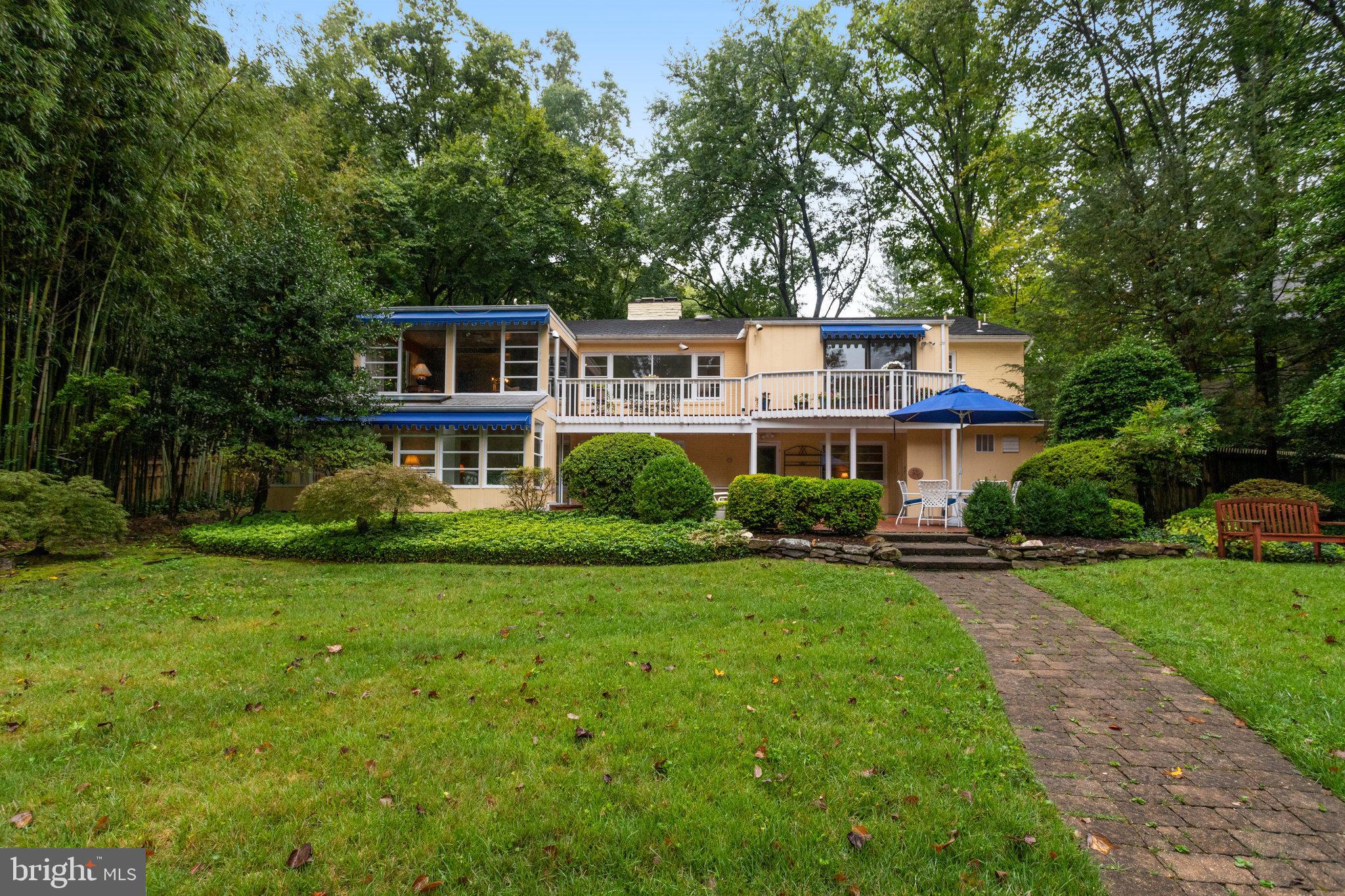 A Lakeside Symphony: Your Mid-Century Modern Dream Home
As you approach 6514 Lake View Drive in Falls Church, the world seems to slow down. The gentle lapping of Lake Barcroft's waters and the rustling of leaves in the breeze create a soothing melody, welcoming you to your new home. This isn't just a house; it's a sanctuary where nature and architecture dance in perfect harmony.
Inspired by the principles of Frank Lloyd Wright, this Mid-Century Modern masterpiece seems to emerge organically from its surroundings. As you step inside, you're immediately struck by the seamless blend of indoor and outdoor living. Expansive windows frame breathtaking views of the lake, inviting nature to be a permanent guest in your home.
The open main level unfolds before you, a testament to thoughtful design. The kitchen, with its built-in pantry, flows effortlessly into a spacious living and dining area. Here, a cozy gas fireplace adds warmth and character, making it the perfect spot for family gatherings or quiet evenings with a good books.
Continue your journey to the sunroom, where a deck awaits – your personal viewing platform for nature's daily spectacle. Watch as majestic eagles soar overhead and graceful herons wade in the shallows. This is more than a view; it's a front-row seat to the wonders of lakeside living.
The home's four bedrooms offer peaceful retreats, with the primary suite taking center stage. Overlooking the lake, it's a private haven complete with an en-suite bathroom and generous closet space. Honey blond hardwood floors flow throughout the family room, their warm tones echoing the natural beauty outside.
With nearly 3,500 square feet of living space, this home offers room to breathe, to create, to live. A family room on the main level, complete with another gas fireplace, provides additional space for relaxation or entertainment. Built-in storage and bookshelves throughout the home ensure that every item has its place, allowing you to live clutter-free and focused on what matters most. With the kitchenette located in the lower level this could work as a multigenerational home or  an au pair suite. Think of the possibilities.
Step outside onto your beautifully landscaped lot, where a private backyard beckons. A side-loading two-car garage and workshop cater to practical needs and hobbies alike. But the true magic lies just beyond your property line – five sandy beaches with life guards, exclusive to the Lake Barcroft community, invite you to swim, boat, fish, and create lasting memories.
While it feels a world away, this lakeside retreat is remarkably connected. Metro bus stop just a blocks away and easy access to major commuter routes mean that the bustle of Arlington, Tysons, DC, and beyond is within easy reach. It's the perfect blend of secluded paradise and urban convenience.
This isn't just a home; it's a lifestyle. It's morning coffee on the deck as the mist rises from the lake. It's weekends spent on the water, surrounded by friends and family. It's the peace of mind that comes from knowing you've found your place in the world.
Welcome to 6514 Lake View Drive. Welcome home.
