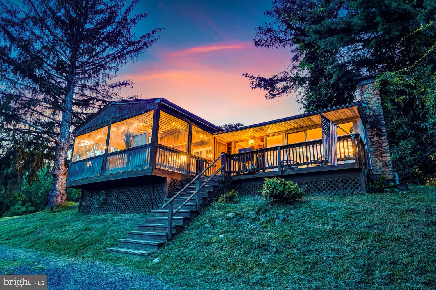 Run as a highly successful vacation rental, this 3-bedroom, 1-bathroom cabin is completely TURNKEY and ready for its next owner! Endless possibilities await, whether you are looking for a proven income-producing investment, a year-round weekend escape, or a low-maintenance primary residence.

This cozy mountain cabin boasts gorgeous views of the Shenandoah Valley from the expansive front deck and the relaxing screened-in porch. Located directly off a state-maintained road, you will enjoy effortless, reliable, year-round access through every season.

Positioned in a prime Page County location, this area is a massive magnet for short-term rentals, making this property a certified revenue winner. Adventure is practically in your front yard, situated just a quarter-mile down the road from the Shenandoah River and Shenandoah River Outfitters. Come swim, kayak, fish, tube, hike, and explore the very best of nature.