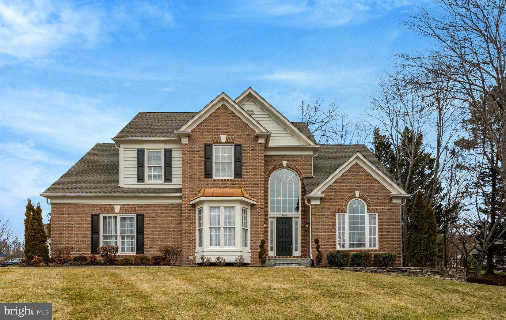 Stately brick-front colonial with a desirable side-load garage offering 4 bedrooms, 2½ baths, and a dramatic two-story family room in the highly sought-after Crosspointe community of Fairfax Station. A stunning two-story foyer with oversized arched window and updated wide-plank flooring creates an immediate sense of light and space, setting the tone for the beautifully maintained interior. The main level features formal living and dining rooms, a convenient butler’s pantry connecting to the kitchen, and a seamless flow ideal for both everyday living and entertaining. The updated kitchen showcases rich wood cabinetry, granite countertops, center island, stainless steel appliances, gas cooking, and an expansive breakfast area filled with natural light, all opening directly to the impressive two-story family room with floor-to-ceiling windows and a classic brick fireplace. Upstairs, the spacious primary suite offers vaulted ceilings and a well-appointed en-suite bath with soaking tub, separate shower, and dual vanities, while three additional bedrooms and an updated hall bath complete the upper level. Step outside to a private rear deck with lattice privacy panels overlooking the backyard, perfect for relaxing or hosting guests. The unfinished lower level provides excellent storage and outstanding potential for future finished space, recreation room, home gym, with plumbing rough-in. Fresh hardscaping enhances curb appeal, and the home sits on a beautifully maintained corner lot within amenity-rich Crosspointe featuring community pools, tennis courts, walking trails, and neighborhood events, all conveniently located near major commuter routes, shopping, dining, and highly regarded schools. Just painted, Brand New Floors, New Appliances, Roof + HVAC replaced, move in ready! Open Sunday March 8 from 1:00-3:00 PM