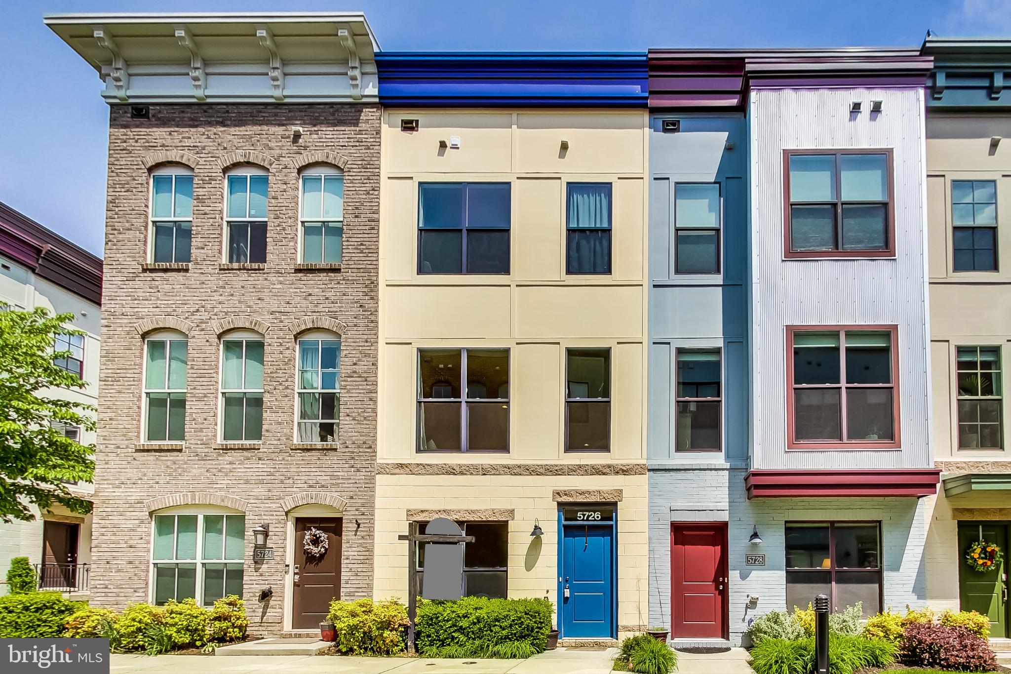 This meticulously cared for B Model townhome boasts 3 bedrooms, 3.5 bathrooms, hardwood floors, a new HVAC system (2019),  2 Ecobee Smart thermostats, and an office/den on the first floor overlooking a beautiful courtyard. The main level (2nd floor) has an open concept floor plan with a gourmet kitchen featuring stainless steel appliances, an upgraded industrial kitchen faucet, granite countertops, sleek cabinetry, and a spacious breakfast area. The 3rd floor features a large primary suite with a spacious full ensuite bathroom with beautiful tile floors and granite countertop, new (2020) LG washer and dryer, and a second bedroom with plenty of closet space and a full ensuite bath. The 4th floor features a light-filled flex/entertaining space, a third bedroom with an ensuite full bath, and a stunning rooftop terrace with new turf and outdoor tiles, panoramic views, and plenty of room for seating and a fire pit or grill. This home is convenient and close to everything you need, with easy access to Whole Foods, YES! Organic Market, Busboys & Poets, Franklins, Vigilante Coffee, local breweries, and neighborhood shops. Enjoy jogging/biking on one of the numerous trails nearby. The HOA includes access to the Lustine Center gym, pool, business center, lounge, pool table, tot lots, and a private community. Only a half-mile to Riverdale MARC station and 6 miles from downtown DC.  Link to 3D tour: https://real.vision/5726-46th-place