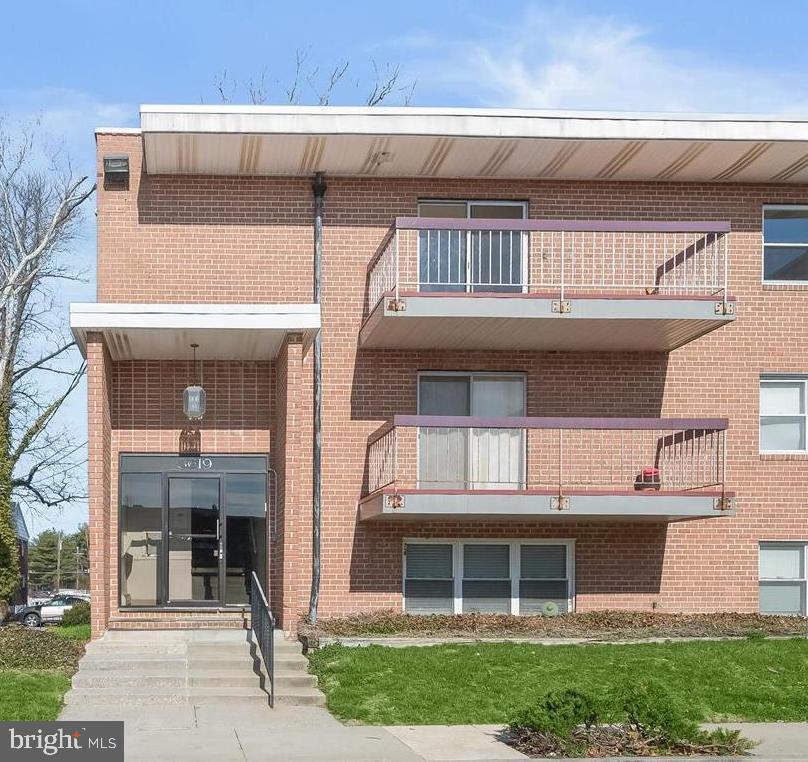 This exceptional top-floor residence is the largest unit in sought-after The Regency, offering an impressive 2,354 square feet of beautiful, updated living space. This unique corner condo features four spacious bedrooms, 2.5 baths, and two private balconies, with expansive views from nearly every room.  A large, sun-filled living room with a private balcony showcases beautiful wide-plank LVP flooring and creates a bright, inviting space to relax or entertain. The dining room flows into the spacious modern kitchen featuring a striking mosaic tile backsplash and stainless steel appliances. The primary suite offers a wall of closets and a private en-suite bath, while two additional sizable bedrooms and a full bathroom complete this wing of the home, with abundant storage provided by multiple closets throughout.  Just off the foyer is a convenient powder room and a large laundry room with built-in shelving. A versatile fourth bedroom features a brick fireplace and opens to its own private balcony, perfect for guests or easily used as a home office, family room, or flexible living space.  Additional highlights include an oversized laundry room and includes a designated parking spot #37, closest to the front entrance.  Ideally located near major commuter routes with convenient access to shopping, dining, and entertainment options. (some photos have been virtually staged)