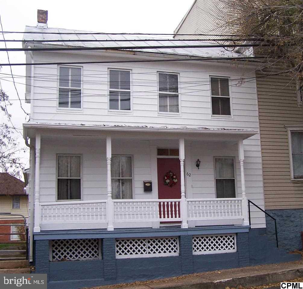 Charming 1880 2 story. Ready to move in! Freshly painted rooms, random plank flooring, updated kitchen with a quaint non function "walk-in" style fireplace, new oak cabinets, counters, back-splash, double bowl stainless steel sink and flooring. Second floor laundry, large walk-in closet. Full walk-up attic. Charming front porch. Large back fenced yard. Walk to Town! "A REAL DOLL HOUSE"