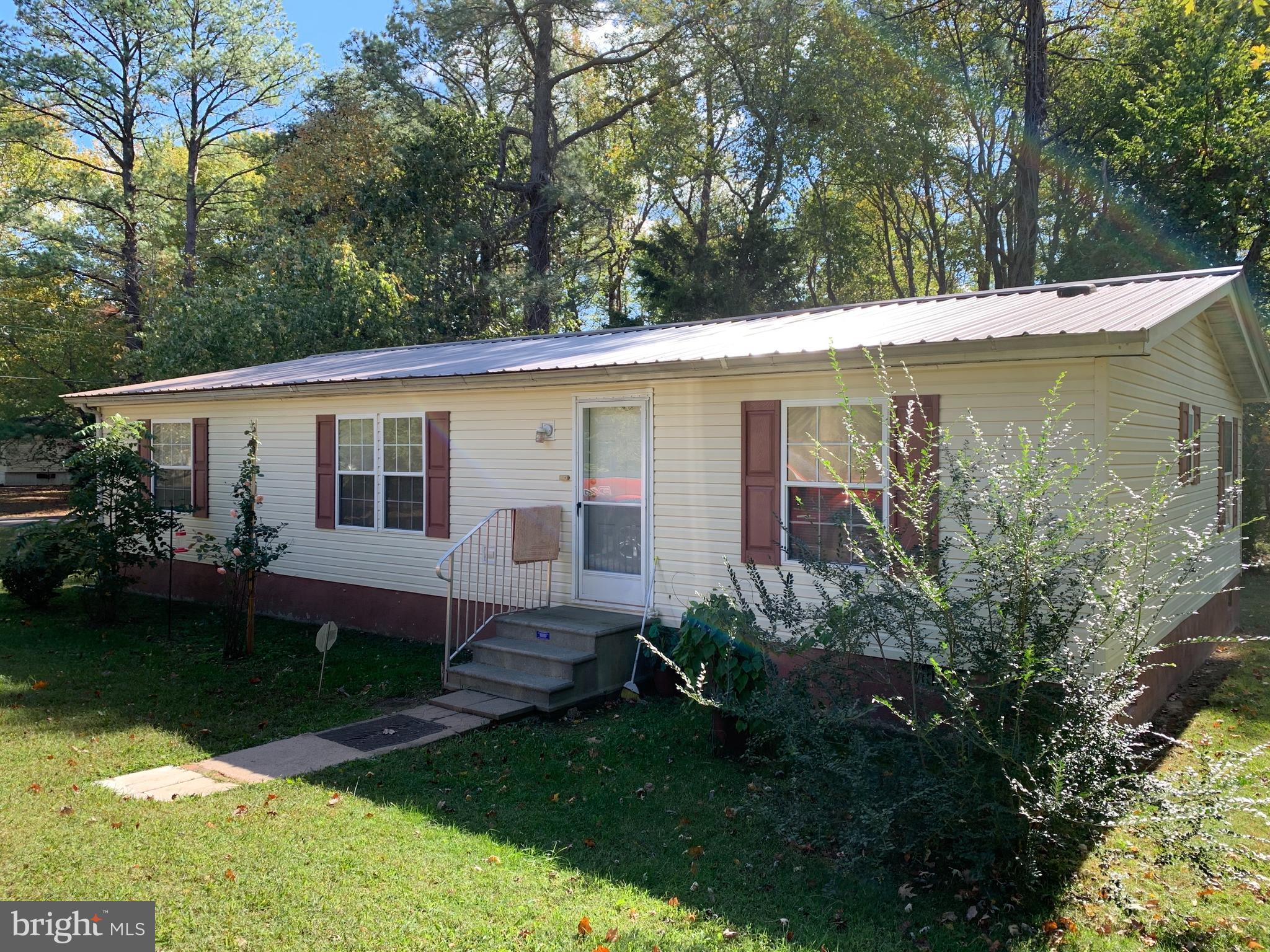 4 acres w/ trailer, trailer sold AS-IS. Possible 3 additional buildable lots - all percs approved.