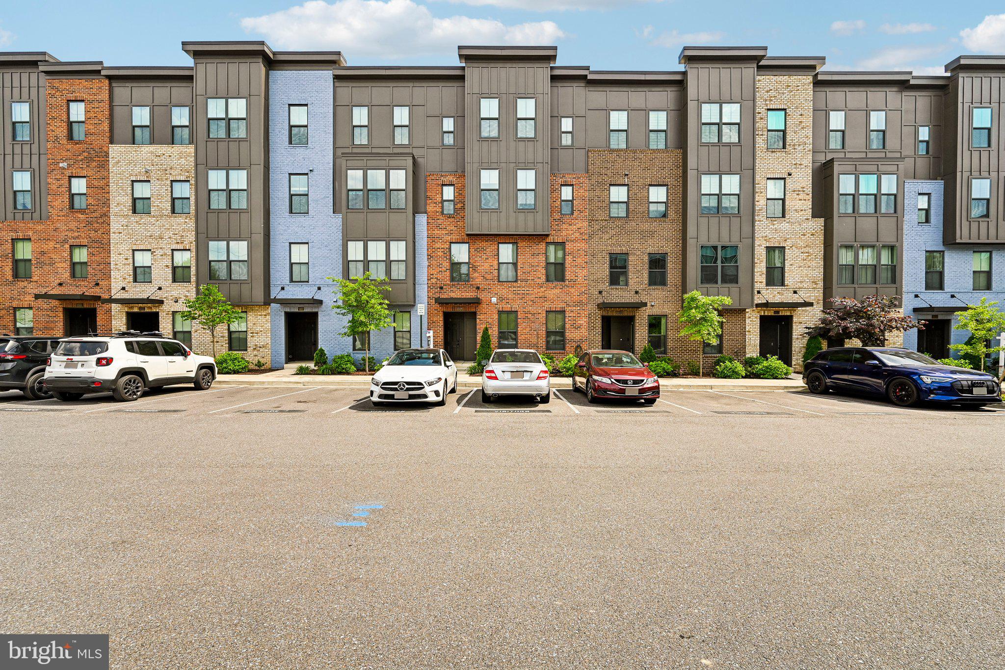 Welcome home to Paddock Pointe, one of Howard County’s sought-after townhome condominium communities. This beautiful Hayes model offers an open-concept layout designed for comfort, style, and everyday entertaining. The luxurious chef’s kitchen features granite countertops, stainless steel appliances, a wall oven, built-in microwave, and generous workspace, all opening seamlessly to the spacious living area.

Step through the elegant custom blinds to the Sky Lanai, a signature covered outdoor deck complete with a built-in fireplace and TV outlets. It is the perfect space to relax, entertain, and enjoy outdoor living year-round. A conveniently located powder room completes the main level.

Upstairs, the impressive primary suite features a massive walk-in closet and a spa-inspired ensuite bath with dual vanities and a spacious walk-in shower. Two additional bedrooms, a full hall bath, and an upper-level laundry room with utility sink add function and convenience. The exterior of the home is equally impressive, featuring a classic brick front that exudes curb appeal. The attached rear-entry garage provides convenience and additional storage options. 

Just beyond your front door, enjoy access to approximately 22 acres of open space, walking trails, a planned dog park, and a community garden. Ideally located near the Maryland Jockey Club at Laurel Park and the nearby MARC train station, this home offers the perfect blend of comfort, convenience, and community.