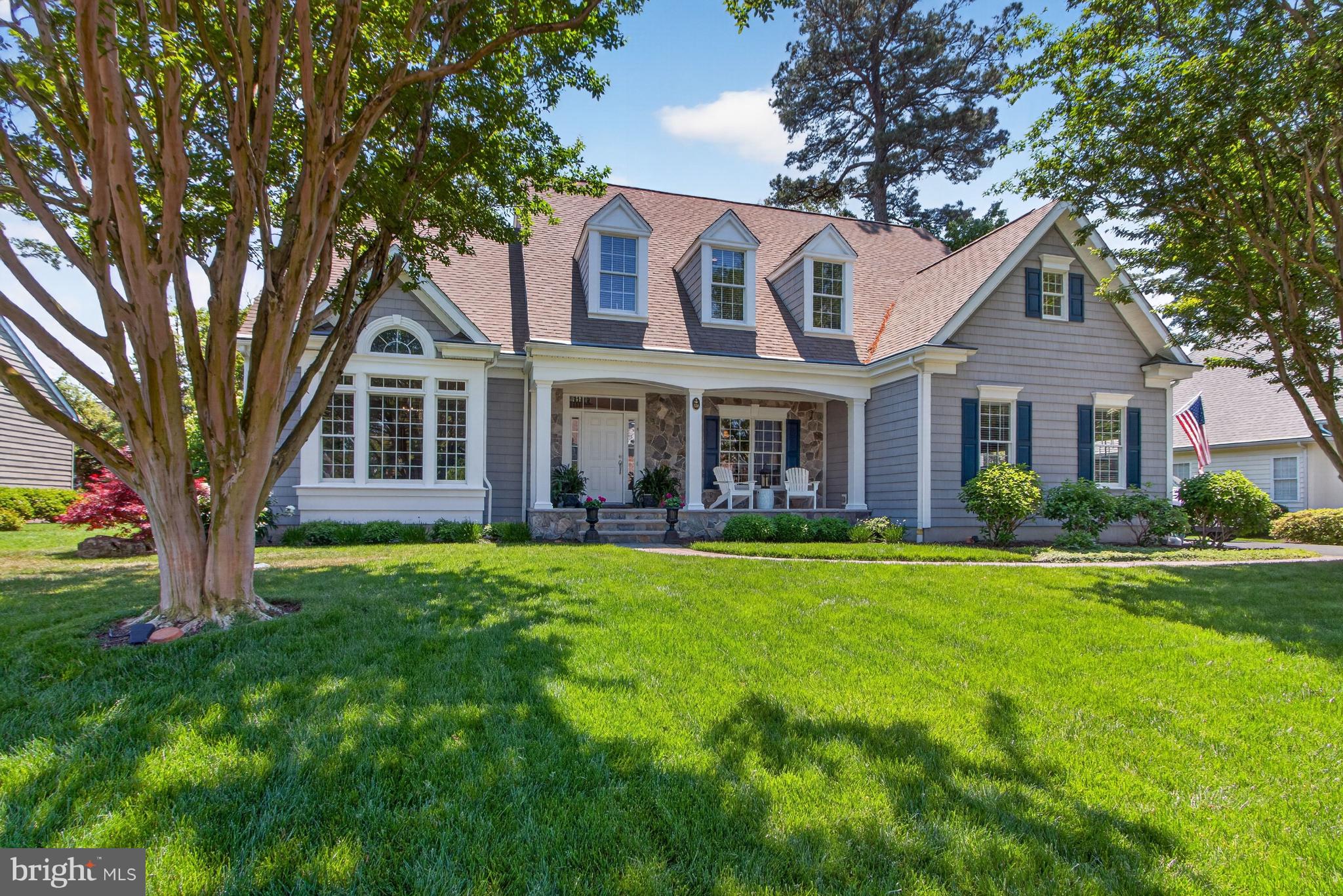 A custom-built masterpiece in one of Rehoboth's most coveted communities! Tucked away on a quiet cul-de-sac off Blackpool Road, 106 Cambridge Way is a stunning, meticulously maintained, and thoughtfully upgraded 5-bedroom, 4.5-bath McGregor Home.

From the moment you arrive, the curb appeal is undeniable. An extra-large driveway accommodates 6+ vehicles and leads to a side-entry 2-car garage. Step inside to a two-story vaulted entry foyer, where 4-inch white oak hardwood floors flow seamlessly throughout, and Anderson 400 Series Windows with Stormwatch® provide superior coastal protection.

The great room impresses with vaulted ceilings, a new gas fireplace with marble surround, custom cabinetry, and Hunter Douglas motorized blinds. French doors with floor-to-ceiling windows frame breathtaking views of the Trex deck and lush backyard. The fully renovated kitchen (2025) boasts a Sub-Zero refrigerator, Wolf professional cooktop, double GE Monogram ovens, Subzero wine refrigerator, custom stone counters, and a walk-in pantry.

The first-floor owner's suite is a true retreat with a sitting area, cove ceiling, deck access, and a renovated bath (2025) featuring an oversized walk-in shower, double vanity with marble countertops, and heated marble floors.

Upstairs, four additional bedrooms await – three with private en-suite baths. A second primary suite includes a renovated bathroom and private office. A dedicated media room with surround sound and a 65" TV is perfect for movie nights!

Outside, the resort-like grounds feature a cedar screen porch, Trex composite deck with wire railings, built-in gas fire pit, and gas grill — both on the home's propane system. Professionally landscaped grounds are kept lush by a Rain-Bird irrigation system supplied by a well.

Smart home highlights include a whole-house RTI AD-8 Sonos music system, Trane WiFi Smart Thermostat, newly encapsulated crawl space with Wi-Fi-controlled AprilAire dehumidifier, and a professionally monitored security system. The two-zone high-efficiency HVAC was installed in 2023, and a whole-house energy audit was completed in 2026.

Centrally located off Blackpool Road, enjoy easy access to world-class dining, boutique shopping, gorgeous beaches, and the vibrant coastal lifestyle of downtown Rehoboth Beach, all while nestled in peaceful privacy. Schedule your private showing today!