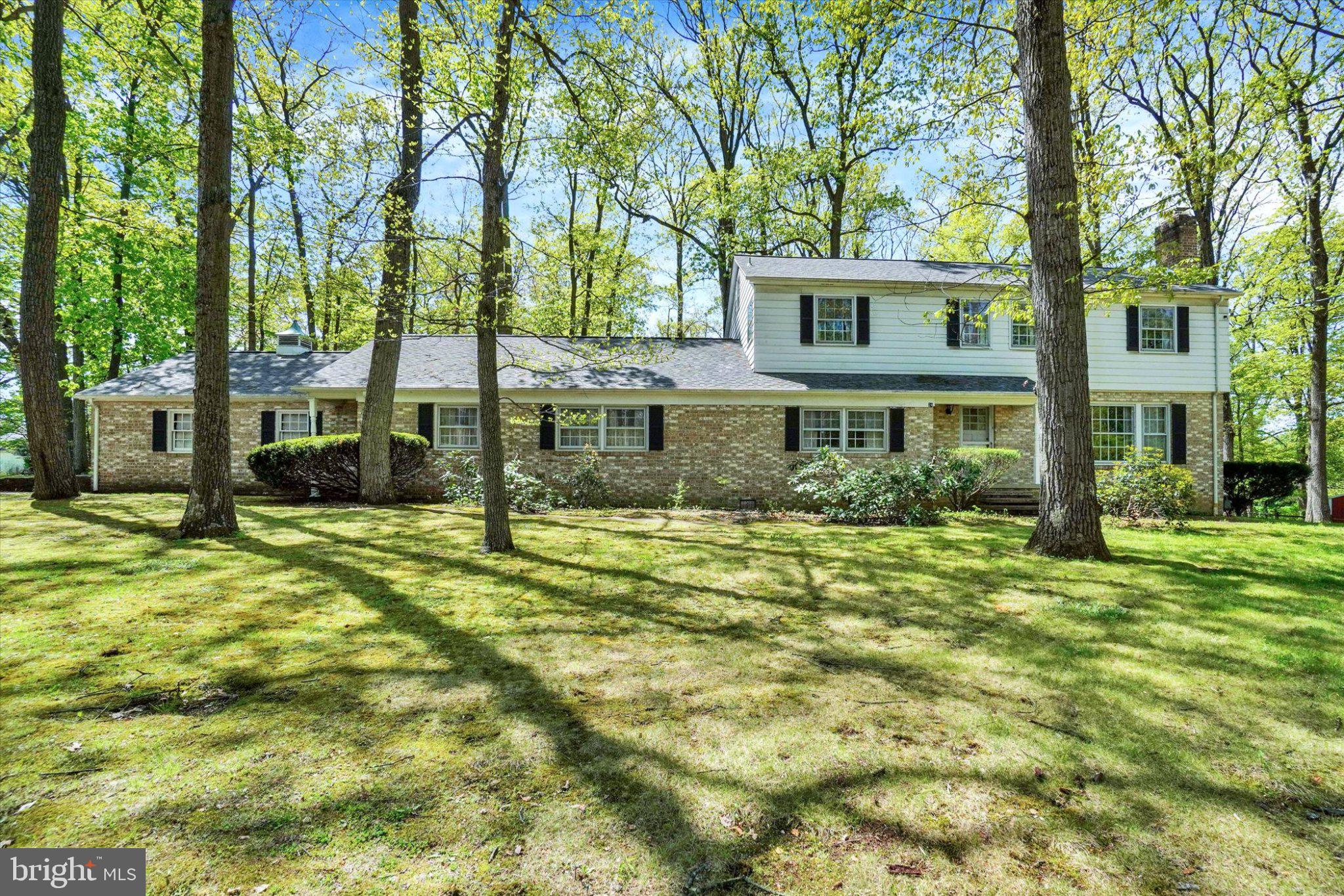 Situated on 1.2 acres across three parcels, this spacious property offers a flexible layout and generous living space. The setting features a mix of open yard and mature trees, providing room to spread out while maintaining a natural backdrop.

The home offers over 3,200 square feet of finished space above grade, including four bedrooms, two full baths, and two half baths. The main level features a living room with fireplace, a separate family room with its own fireplace and built ins, a formal dining room with built ins, kitchen, and first floor laundry. The interior offers classic character with vintage flair, providing a solid foundation for adding your personal touches and modern updates. The upper level includes four generously sized bedrooms, a full hall bath, and a primary bath.

The property includes additional finished space with multiple rooms and a separate layout. The previous owner operated a medical practice from this portion of the home, offering a unique layout. Buyer to verify permitted uses with the municipality.

Additional highlights include an unfinished basement with abundant storage, an oversized two car garage, and a shed. The home also features ample closet space throughout and a large parking area with space for six or more vehicles.

With its spacious layout and room to customize, this property offers a great opportunity to make it your own.