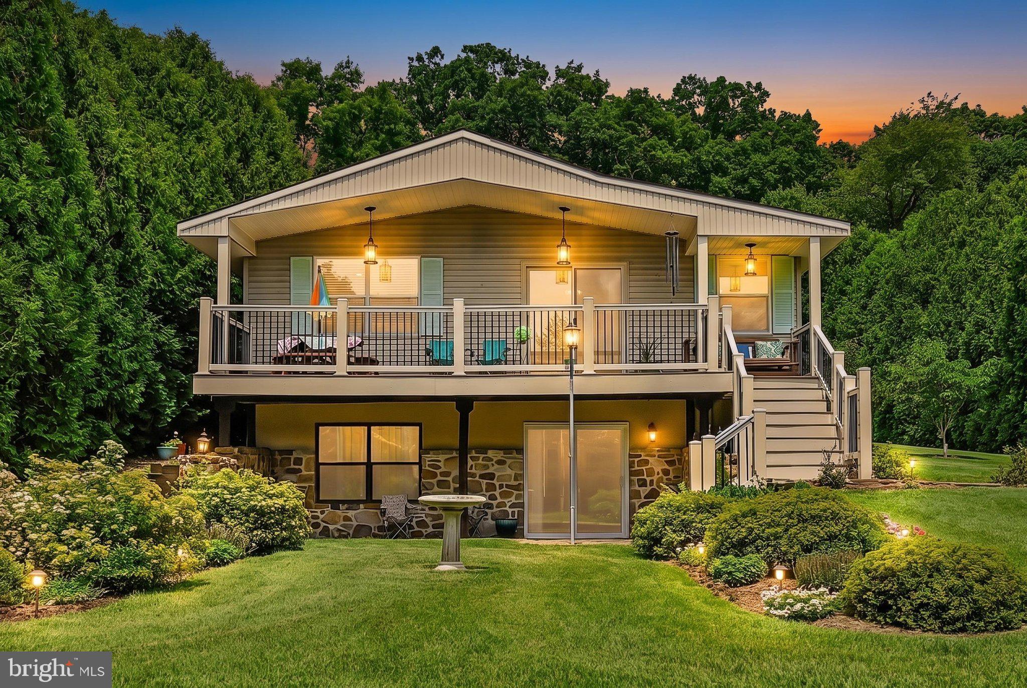 Escape to serenity with this charming 3-bedroom, 2-bathroom raised ranch, perfectly positioned in a private, garden-esque setting. Tucked away in the sought-after gated community of Lake Wynonah, this home offers the ideal balance of peaceful seclusion and amenities, and it is clear that pride of ownership is evident throughout—the sellers have taken great care to maintain and enhance this property. A private tour will confirm that this exquisite home truly exceeds expectations! The main floor welcomes you with an open floor plan that brings a fresh, contemporary feel to the home. The primary bedroom is a true highlight of the main level, featuring two walk-in closets and easy access to a full bathroom that boasts dual sinks. The heart of the house is an updated kitchen featuring gorgeous granite countertops, seamlessly flowing into the dining and living areas—perfect for both daily living and entertaining. A second bedroom with spectacular garden views completes the main floor. The walk-out lower level expands your living space, featuring a charming family room, an additional full kitchen—perfect for in-law quarters, guests, or entertaining—a large bedroom, another full bathroom, and a laundry area. Step outside to your private oasis on this sprawling 0.8-acre lot, which backs to farmland and features lush, mature landscaping, mature arborvitae for added privacy, and a deer-protected garden area already established with fruit trees. Enjoy the outdoors from your low-maintenance composite deck with railing, the stone patio, or the backyard firepit—the ultimate setup for relaxation. Additional notable features include a new roof (2024), central air, a Bosch air handler, a heat pump, an oversized one-car garage, a utility shed, a paved driveway, an attached carport, and a septic system, along with abundant space to cultivate further gardens. Life at Lake Wynonah is truly like being on vacation year-round, with access to two freshwater lakes for fishing and boating, an outdoor pool, tennis and pickleball courts, a lodge with dining, and numerous social clubs. Conveniently located within an hour of Allentown, Harrisburg, Hershey, and Reading, and offering easy access to Philadelphia and surrounding suburbs, this home provides a rare opportunity to enjoy a tranquil, nature-forward lifestyle. Come experience a home where every day feels like a retreat. Contract signed! Dam rehab begins! The BOD has chosen a highly respected, experienced engineering firm for the Lake Wynonah Dam rehabilitation project. Forward and positive momentum and progress!