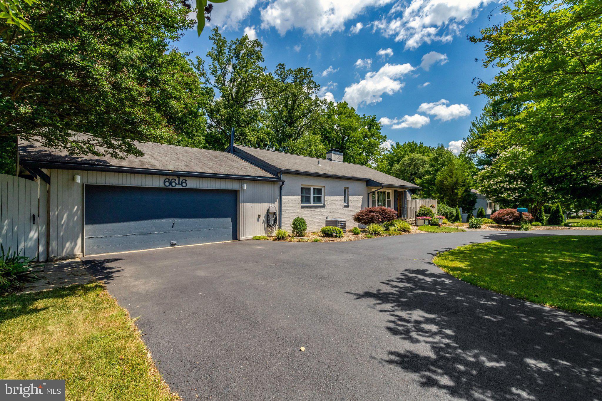 Welcome to this beautifully maintained and thoughtfully updated 3-bedroom, 2-bath rambler with a 2-car garage, offering convenient one-level living and nearly 2,000 square feet of comfortable, light-filled space.
The home features numerous custom updates, including newer windows with plantation shutters and a remodeled open-concept kitchen (2023) designed for both everyday living and entertaining. The kitchen showcases stainless steel appliances, including a gas stove, refrigerator, and built-in microwave, along with granite countertops, hickory wood cabinetry, recessed lighting, a quartz countertop island, and newly installed light fixtures that add a fresh, modern touch (2025).
The sun-filled living room welcomes you with new flooring, a cozy wood-burning fireplace, beautiful handmade wood mantel (2025), band track lighting, creating a warm and inviting space to relax. Just off the kitchen, the separate dining room features beautiful hardwood flooring and track lighting, perfect for gatherings both large and small.
The second and third bedrooms offer hardwood flooring, while the spacious family room features newer laminate wood floors (2023), bright recessed lighting, and a sliding glass door that opens to a private patio, ideal for indoor-outdoor living.
The primary suite offers a peaceful retreat with a large window overlooking the scenic, wooded backyard. The primary bathroom features heated tile floors and a marble countertop, and the adjoining sitting room provides the perfect space to unwind, read, or watch TV. The primary bedroom also includes a newly installed light fixture with ceiling fan (2024) for added comfort.
Step outside to enjoy the expansive and serene backyard, complete with a wood deck and slate stone patio, all set on just over ¾ of an acre, perfect for relaxing, entertaining, or simply enjoying the peaceful surroundings, there is a creek in the back of the backyard.
Ideally located less than a mile from Bradlick Shopping Center, featuring a Giant Food and a variety of shops and restaurants, approximately 1.5 miles from Pinecrest Plaza, and less than 3 miles from Barcroft Plaza, where you'll find Harris Teeter along with additional shopping and dining options.
Enjoy nearby Deerlick Park, and convenient access to Thomas Jefferson High School for Science and Technology, just about 1 mile away. Commuters will appreciate easy access to I-495 and I-395, along with a Metrobus stop just steps away (29F) with direct service to the Pentagon Station.
This home offers the perfect blend of comfort, convenience, and charm, ready for you to move in and enjoy.