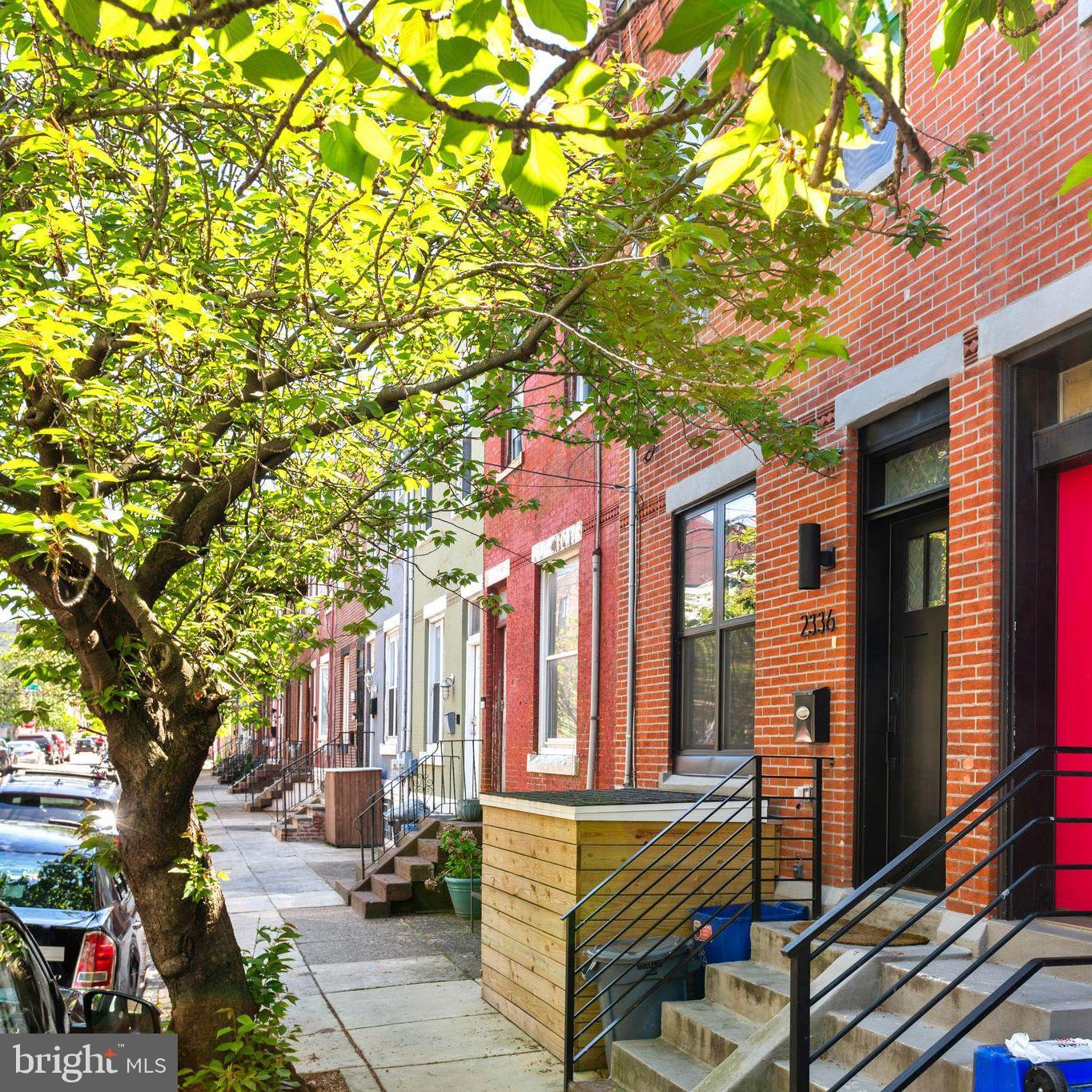 ***Qualified buyers may be eligible for special financing with up to 100% financing, no PMI, and a lender credit of $5000 toward the purchase of this home!*** Modern design and property tax savings on a beautiful, tree-lined block! This fully updated property situated on a large lot on the border of Brewerytown/Sharswood offers a spacious layout with 3 beds, 2.5 baths and 2+ years remaining on the property tax abatement.
Enter through the freshly painted front door into the main level defined by an open-concept layout with hardwood floors and abundant natural light thanks to large windows in front and along the side. The living area transitions seamlessly into a central dining space, accented by a fun chandelier and a powder room for guests. At the rear, the well-equipped kitchen features modern wooden cabinetry, quartz countertops, and a full stainless steel appliance package. Directly off the kitchen, the large, rear patio with wooden privacy fence provides a secluded outdoor area for entertaining, grilling, and flexing your green thumb. Head up to the second level, which houses three distinct bedrooms and two full bathrooms. The hallway leads first to two secondary bedrooms, each featuring integrated closet storage and large windows for natural light. The hall bath is well-appointed with a nice sized vanity and a tub/shower with tile surround. The primary suite is positioned at the front of the home, offering a spacious footprint and a private en-suite bathroom equipped with a frameless glass shower and contemporary finishes. The fully finished lower level adds approximately 400 square feet of versatile living space and is ideal for a dedicated home office, gym, or media room. This level also contains a laundry closet with washer/dryer a mechanical room, and additional storage. Savvy buyers will appreciate the immediate financial value and about $10,000 in property tax savings, thanks to the 2+ years remaining on the tax abatement. Located in on the border of Brewerytown/Sharswood near the Brewerytown commercial corridor, the property is a short walk from local anchors like Rybrew and Human Robot Brewing Co. Outdoor recreation is easily accessible via the Schuylkill River Trail and Fairmount Park, while proximity to I-76 and multiple SEPTA routes ensures efficient transit throughout Philadelphia. *Tax savings estimate based on current assessed value. Assessed value and tax rate are set by the City of Philadelphia and subject to change.* ***Qualified buyers may be eligible for special financing with up to 100% financing, no PMI, and a lender credit of $5000 toward the purchase of this home!***