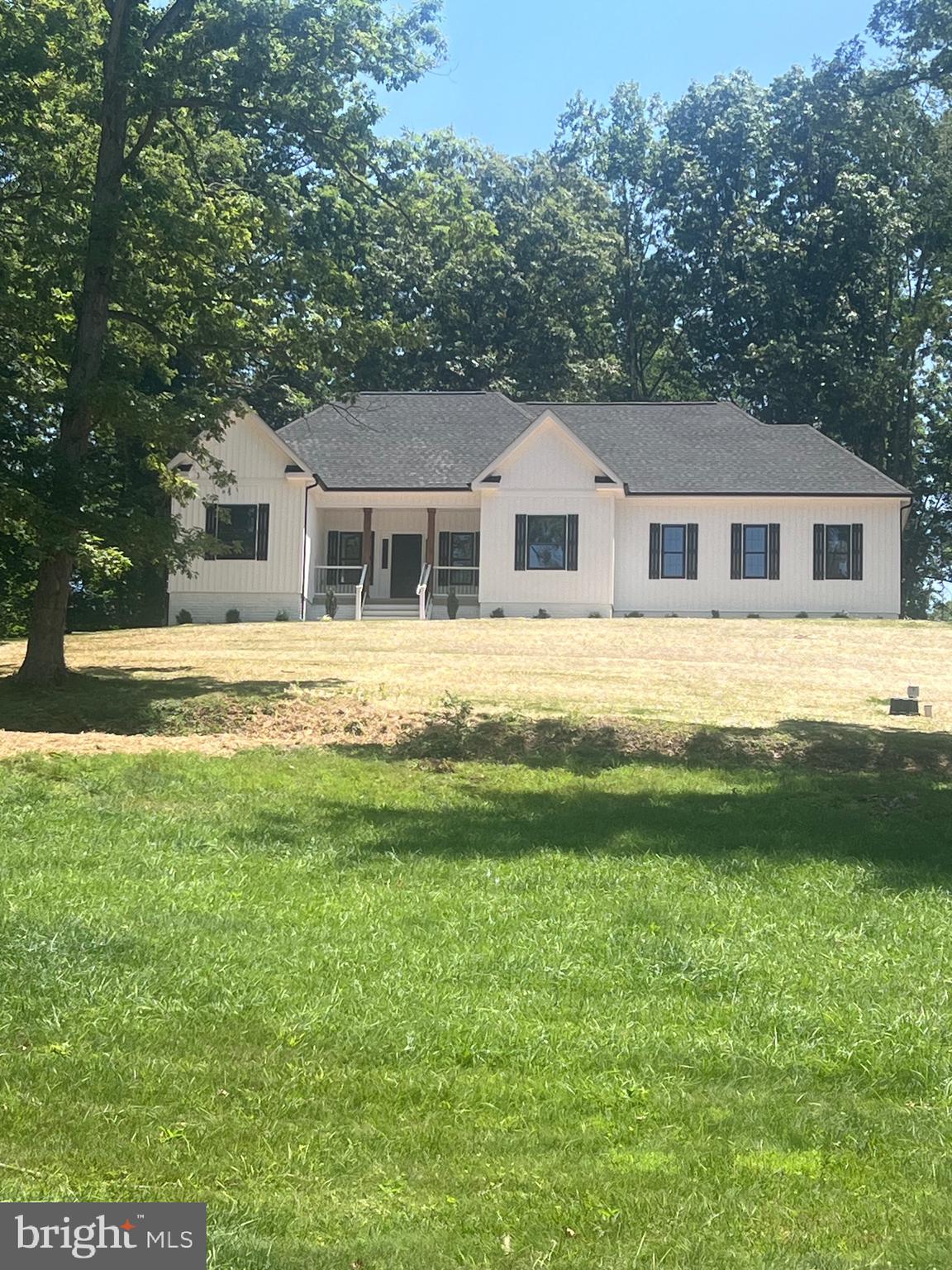 This Brand new Custom Built Rambler is nestled on a 1.59 acre lot with privacy. Conveniently located just outside of town limits of Warrenton. Everything you need on one level. Open flowing floor plan loaded with many upgraded features. Nine foot ceiling height on main level. Family room with cathedral/vaulted ceilings. Crown molding and Chair rail, Granite in kitchen and both baths, Stainless Steel GE appliances. Soaking tub in master bath along with heated tile floor, walk-in tiled shower, spacious walk-in closet. Overhead lighting through out entire home. Full un-finished walk out basement, side load two car garage. No covenances or restrictions. Four bedroom private septic, private well. Home is complete and ready for occupancy.