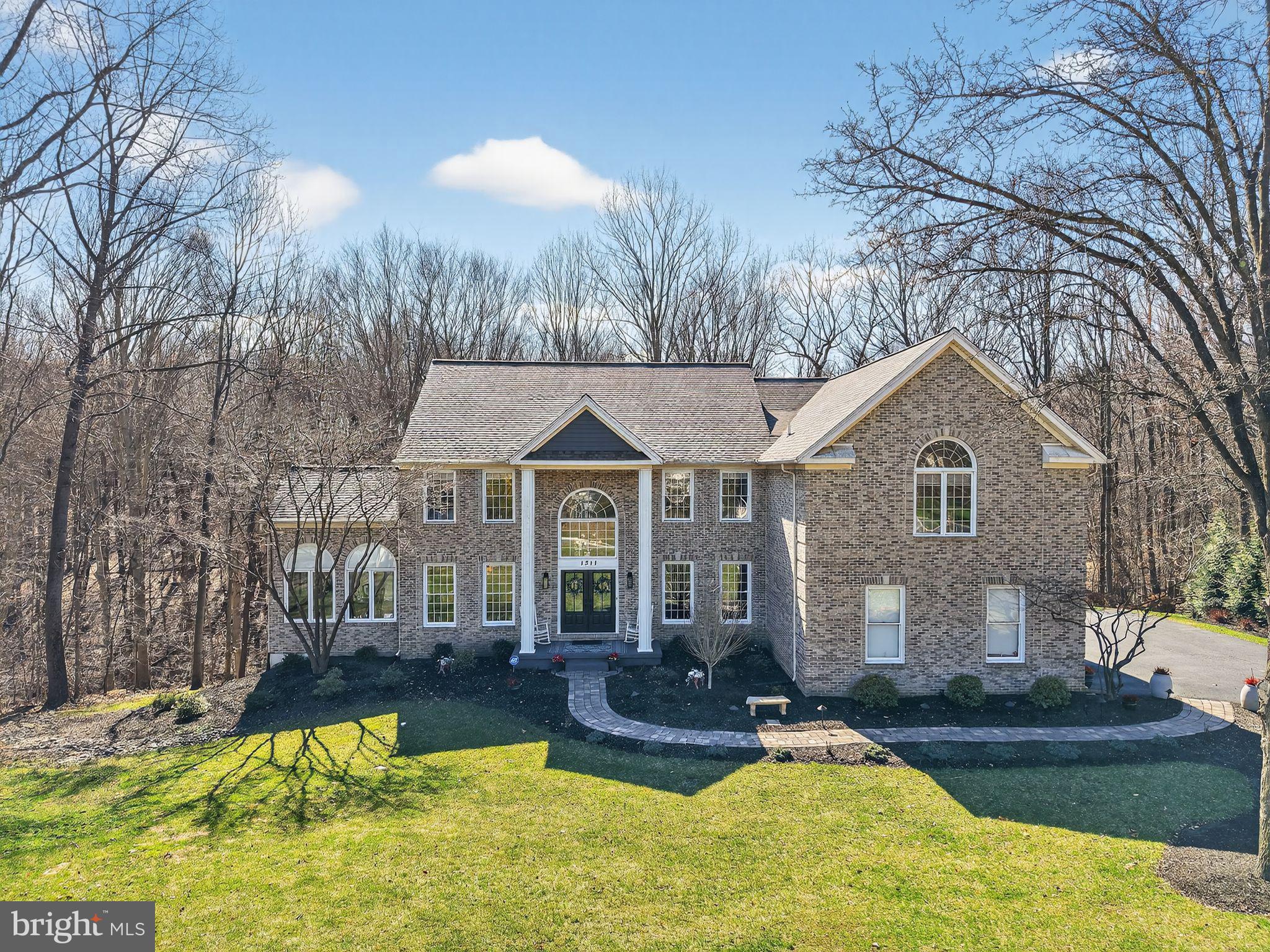 Location, Lifestyle...Community! Residing in the sought after community of Virginia Glen a subdivision of Brandywine Ridge in the award winning Downingtown Area School District and STEM school. Located on a cul-de-sac this extraordinary estate is nestled on 2.5 private acres surrounded by mature trees! Showcasing over $300k in curated upgrades, this exceptional residence embodies timeless elegance, modern sophistication and the very best of Chester County living! This turn key home has been newly sided along with double French doors to welcome you home. All new landscaping with dusk to dawn lighting and walkway showcases the beauty of natural stone and the elegance of massive chandeliers lighting each room. A two story foyer, where rich hardwood floors and abundant natural light set the tone for the home's refined interior. A gracious parlor flows seamlessly into an impressive dining room with vaulted ceilings surrounded by Palladian casement windows. An exquisite setting for both formal entertaining and intimate gatherings. The heart of the home is a show stopping, fully reimagined  chef's kitchen. Custom cabinetry extending to the top of nine foot ceilings with detailed moldings are accented by a custom backsplash, striking black and gold fixtures, and centered by an oversized statement island with pendant lighting. Premium stainless steel appliances, double wall ovens, beverage center and luxurious marble countertops with under cabinet lighting making this space as functional as it is stunning! The adjoining two story family great room is anchored by a dramatic floor to ceiling stone gas fireplace surrounded by walls of windows with plantation shutters! Enhancing the homes versatility, the main level features a private executive office that can effortlessly serve as a first floor bedroom, with convenient access to a full bath ideal for guests, multigenerational living, or refined work from home flexibility. Entertaining is effortless with a bar to gather and celebrate to watching a game together making memories to last a lifetime. The second level of the home offers four possibly five bedrooms. Upstairs, the primary suite offers a true retreat complete with vaulted tray ceilings, a serene sitting room and custom walk-in closets. The spa inspired  bath is thoughtfully appointed with dual vanities, an oversized jetted soaking tub and a marble tiled walk-in shower. A princess suite with a private bath, along with two additional bedrooms to share a hall bath. The finished lower level is designed for elevated entertaining, featuring new flooring, a custom bar and expansive recreational space along with a multitude of storage. Moving outdoors, a private resort style setting awaits. Highlighted by a newly installed bluestone slate patio perfect for a fire pit to gather along with a six person hot tub to enjoy and gather! Last but not least a newly updated 35x20 maintenance free deck offering over 850 sq ft of added living with privacy and tranquility. This estate is more than a residence, it is a a statement of luxury, comfort and lifestyle! Located at the gateway to Chester County with major routes, train, shopping and fabulous restaurants to enjoy!