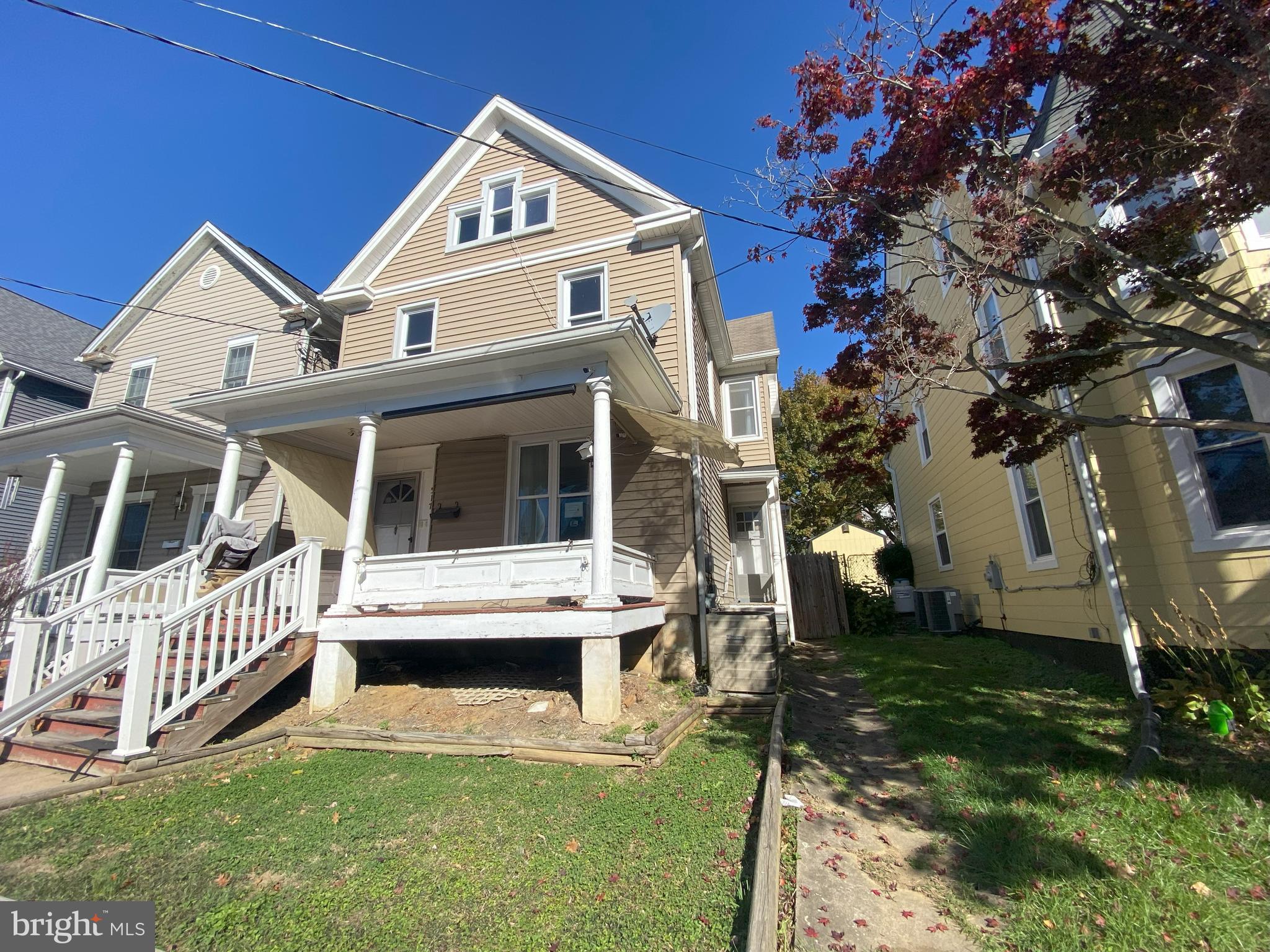 Old World Charm-high ceilings (12 ft main level), wood floors, large living room and dining room, built-ins, original woodwork, crown moldings/chair rail/China cabinet, grand staircase, covered front porch, 2 full baths, 5 ceiling fans, fenced yard & a walkup floored attic! Updates-wiring, 2 CAR PARKING PAD-REAR ALLEY with storage shed.

Close to Train Station, Potomac River, Post Office, and shopping.......All walkable

Come make this house your home today.