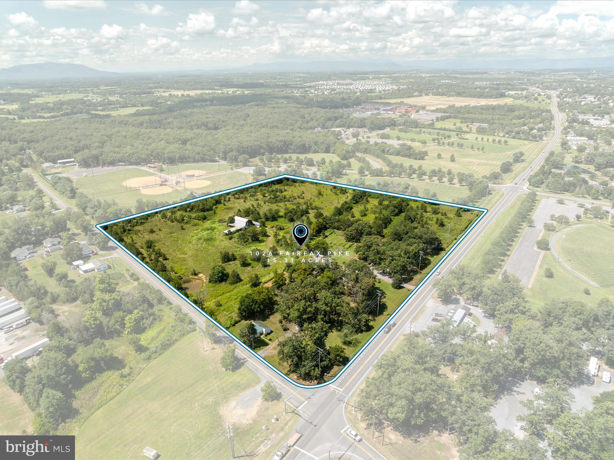 Positioned just east of Stephens City and minutes from Interstate 81, this 15.31-acre corner lot offers exceptional development potential in one of the region’s most desirable growth corridors. Currently zoned RA (Rural Areas), the site supports multiple permitted and conditional commercial uses, with unlimited commercial possibilities through rezoning.  Boasting over 800 feet of frontage on Rt. 277 and a high-visibility signalized intersection, the property ensures maximum exposure for future development.  Located within the County’s Urban Development Area (UDA) and Sewer and Water Service Area (SWSA), the site is primed for connection to public utilities, streamlining development timelines.  Surrounded by Sherando Park, near Sherando High School, and adjacent to established residential neighborhoods, this property benefits from strong local traffic and a built-in customer base.  This is a rare chance to secure a highly visible, strategically positioned property ready for your commercial vision.
