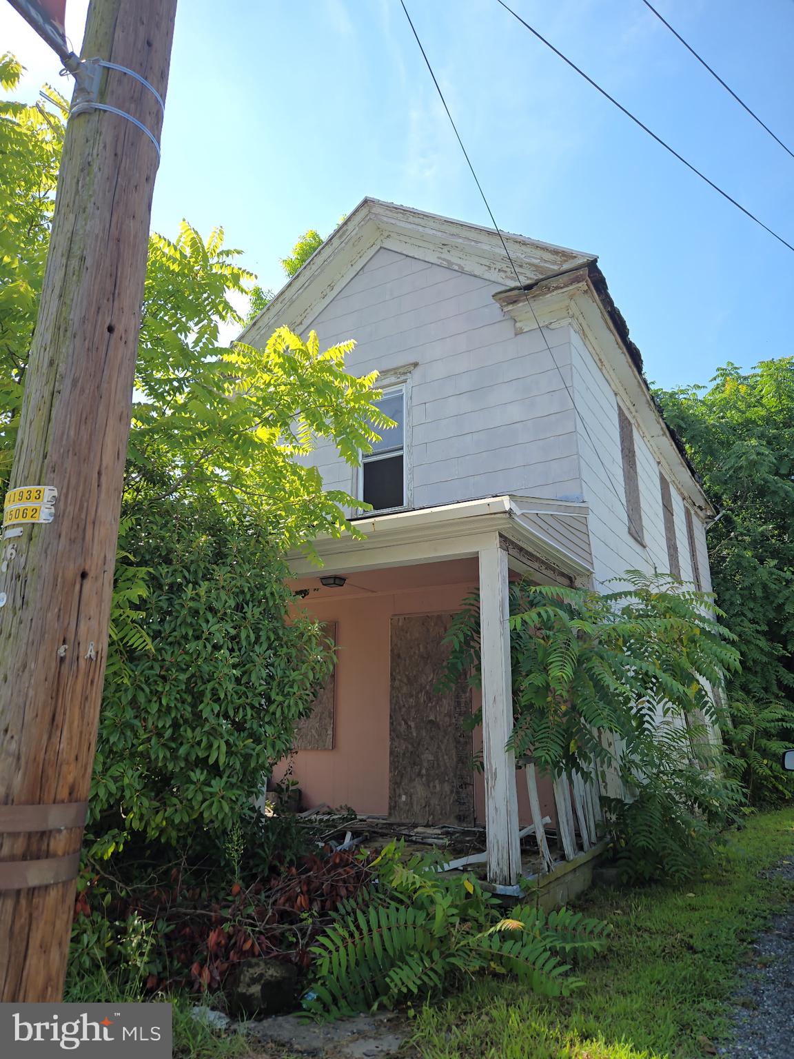 Investor special! This property is being sold AS-IS and is priced for land value or a full renovation. The existing structure requires extensive repairs or complete tear-down—ideal for experienced builders, contractors, or savvy investors looking for a project. Buyer to verify zoning, permits, potential use. Buyer Broker/Agent and/or Buyer must do their own due diligence to verify if the existing structure or land is suitable for building.. No warranties, guarantees, or repairs will be made by seller.