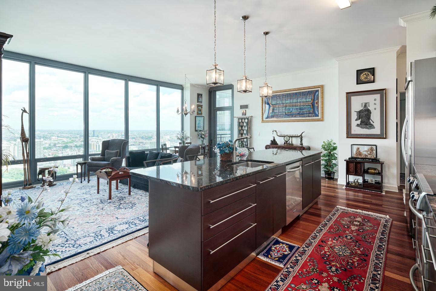 CONDO INCLUDES 2 PARKING SPOTS! A spacious and luxurious 1455 sq.ft. Penthouse condominium with unobstructed, spectacular Northern City views including Philly landmarks like the Art Museum, Schuylkill River, Boathouse Row and the Franklin Institute all from the 41th floor! This 2bed/2.5bath residence is modern and luxurious boasting granite countertops, wood floors, stainless steel appliances, 10.5-foot ceilings, and floor to ceiling windows and private balconies!! Upgrades include custom closets throughout. Master bedroom has an ensuite bathroom with double sinks, separate bathtub and shower. A private balcony offering extended views of the city. Live like a VIP at The Murano with all it's amenities! 24/7 concierge services, heated indoor lap pool, state-of-the-art fitness center, sun terrace, community room and much more. The price includes two reserved parking spaces in the attached covered garage, and a separate large storage locker