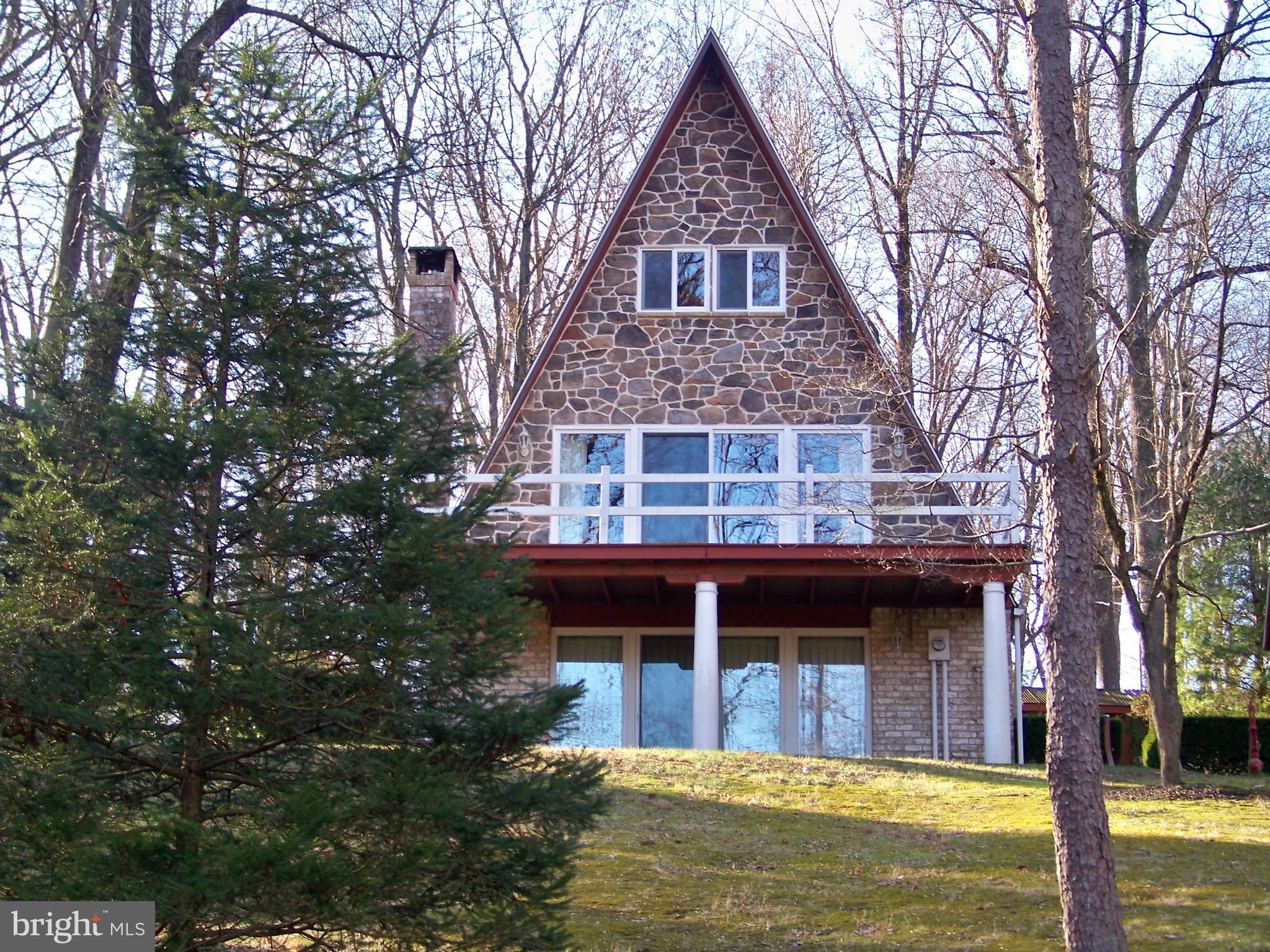THIS PROPERTY TO BE OFFERED AT PUBLIC AUCTION ON APRIL 20, 2024 BY LEFEVER & HART AUCTIONS LLC. LISTED PRICE DOES NOT INDICATE SALE PRICE, THAT WILL BE DETERMINED BY HIGHEST BID AND ACCEPTANCE BY SELLER. 
Nice Well- Maintained House And Property In Penn Manor School District On 1.1 Acres Lightly Wooded Lot. This A-Frame Home Offers Ground Level Family Room w/ Wood Burning Fireplace, Laundry, Full Bath & One-Car Garage. Main Level Hosts Living Room w/ Sliding Doors To Deck, Kitchen & Dining Area, Bedroom & Full Tub Bath. Upper Level Features Two Bedrooms & Large Closet. Detached 20' x 25' Garage W Heat & Electric And Full Upper Floor Barn/ Workshop w/ Electric. Rear Yard Storage Shed. Very Nice Setting!!
