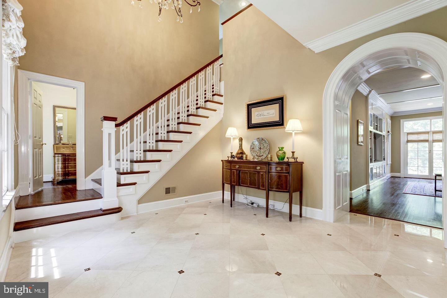 Magnificent, Georgian inspired, home in sought after Avenel!!!  Unsurpassed quality and design, polished marble entry with archway to gracious sized rooms. Inviting living room,  banquet sized dining room with custom built-in cabinetry,  private library, delightful large kitchen and family room overlooking gorgeous terraced pool and 2 acre private mature woodland trees and gardens.  Bright rooms throughout, with daylight lower level to include family room with fireplace, in-law suite,  second full kitchen,  yoga studio, 6th bedroom, exercise room and more! Primary Suite also overlooks rear oasis. Second level bedrooms each have their own private bath. Digital light system to garden and trees is breathtaking!