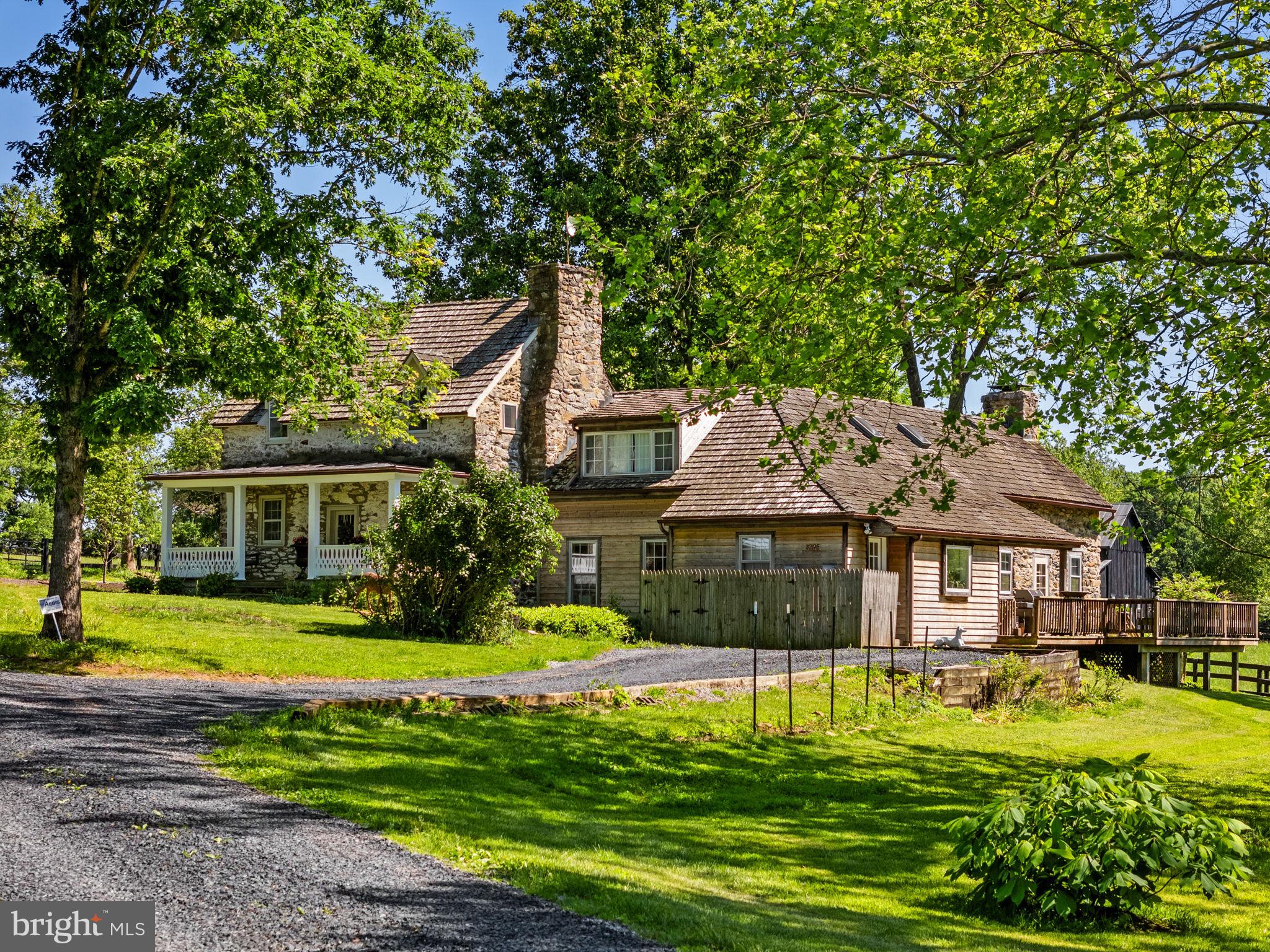 Small Spring Farm is being offered for the first time in over 50 years. Nestled on 27 scenic acres just north of Upperville, this charming horse property enjoys beautiful Blue Ridge Mountain views and offers a rare combination of history, character, and equine amenities in the heart of Virginia's hunt country. At the center of the farm is a unique residence created by linking two historic stone cottages, one dating back to 1812. The result is a warm and inviting home that can function as a single residence or as two connected living spaces, each with its own kitchen making it ideal for extended family, guests, or a variety of living arrangements. Together, the home offers four bedrooms, four full baths, original hardwood floors, three fireplaces and numerous spaces for gathering and entertaining. Outdoor living is equally appealing, with a covered front porch, side porches, and a spacious rear deck overlooking the surrounding countryside and capturing spectacular sunset views. Equine facilities include a six-stall center-aisle barn with hayloft, five fenced paddocks, a round pen, riding ring and a large run-in shed. A detached equipment building provides multiple storage bays, a garage, and a charming one-bedroom, one-bath studio apartment with its own private garden. Protected by a VOF conservation easement and located within Piedmont Hunt territory, Small Spring Farm offers the privacy, beauty, and rural character that make this area so sought after. All buildings are currently tenant occupied and require 24 hours' notice to show. No drive-ins.