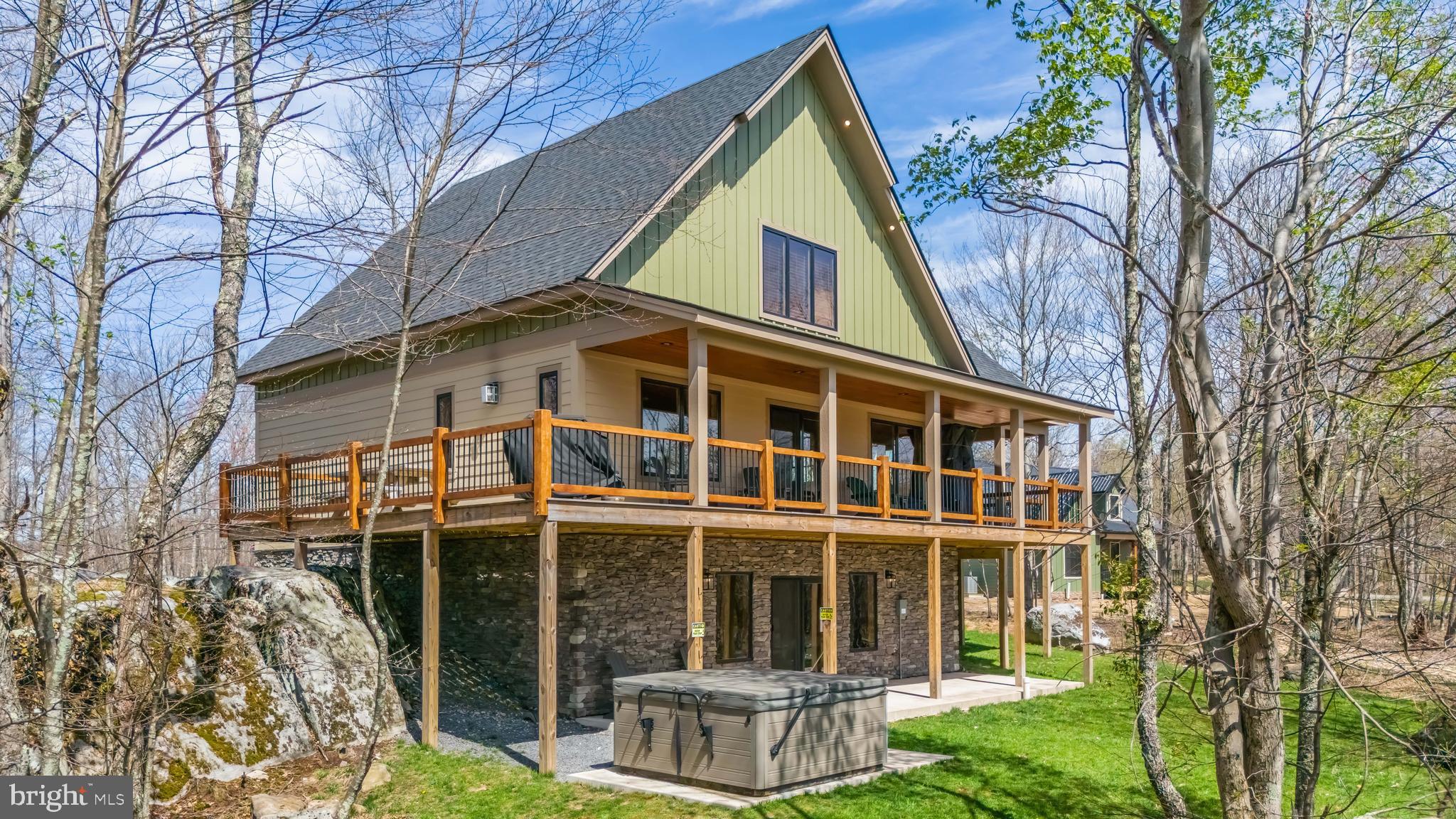 Perched atop Wisp Mountain in the Lago Vista community you’ll find this wonderful 5-bedroom retreat “Big & Boulder”. This exceptional five-bedroom home blends rugged natural beauty with refined comfort. The 3-levels offer an open floorplan and two gathering areas, with a gas fireplace on the main level and gaming tables on the lower level. Massive native boulders frame the property, creating a striking landscape that feels both timeless and one-of-a-kind. Inside, spacious living areas are designed to provide private rooms with large windows inviting in natural light and the surrounding scenery. The location remains private but very close to Lodestone Golf Course and Wisp Ski Resort. Call to preview!