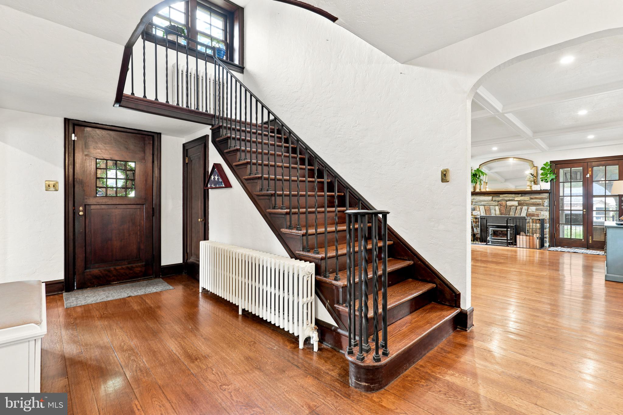 Welcome to this timeless 5-bedroom, 2.5 full-bath stone home, where charm meets modern updates. Nestled on a beautifully landscaped lot with mature trees, this exceptional property offers stunning curb appeal, spacious living areas, and incredible indoor-outdoor entertaining—all in the heart of the highly desirable Lansdale community.
Inside, you'll find hardwood floors, rich woodwork, and a grand curved staircase that showcase the home's classic character. The spacious living room features a beautiful stone fireplace, coffered ceiling, oversized windows that fill the home with natural light, and French doors leading to the inviting covered porch. A formal dining room flows seamlessly into the beautifully renovated kitchen, complete with custom cabinetry, quartz countertops, stainless steel appliances, a large center island, and an adjoining breakfast area—perfect for everyday living and entertaining.
The second floor offers five generously sized bedrooms and two full bathrooms, including a beautifully renovated bath with a double vanity and glass-enclosed shower, as well as a charming vintage bathroom featuring an original clawfoot tub that preserves the home's historic appeal.
Step outside to your own private retreat. The backyard is designed for entertaining with an expansive composite deck, a fully equipped outdoor kitchen featuring a built-in grill, sink, refrigerator, bar seating, and TV, a covered stone patio, fenced yard, and plenty of space to relax, garden, or play. Completing the property is a detached three-car garage, providing abundant space for vehicles, storage, a workshop, or hobby area.
Beyond the property, you'll enjoy everything Lansdale has to offer. The vibrant downtown features locally owned restaurants, coffee shops, breweries, boutiques, and year-round community events, including the popular Founders Day Festival, First Fridays, farmers markets, holiday celebrations, and concerts. Outdoor enthusiasts will appreciate nearby parks, walking trails, playgrounds, and recreational facilities, including Whites Road Park, Stony Creek Park, and the extensive trail system connecting surrounding communities.
Commuters will love the convenience of the nearby SEPTA Regional Rail station, offering direct service to Center City Philadelphia, as well as easy access to major roadways including Routes 63, 202, 309, the Pennsylvania Turnpike (I-476), and Route 476, making travel throughout Montgomery County, Bucks County, and beyond simple and efficient.
Blending timeless Tudor architecture with thoughtful modern updates and an unbeatable location, this one-of-a-kind home offers character, comfort, exceptional indoor-outdoor living, and the convenience of everything Lansdale has to offer.