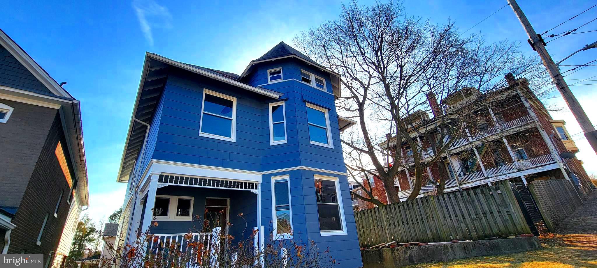 Stately house in desirable neighborhood features 4 levels including basement. Large rooms, high ceilings and plenty of charming hardwood floors and trim.  
This home has much potential.  Needs rehab.  Power and water have been updated and restored.