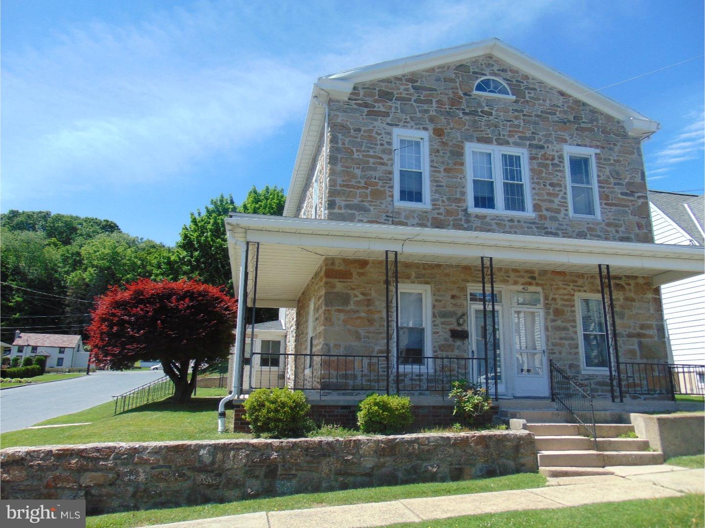 This well kept home still features deep window sills & stone exterior on the original portion of the home.  Newer replacement windows. Spacious living & dining rooms. Efficient gas heat. Corner property with off street parking.  Nice front & side porches.