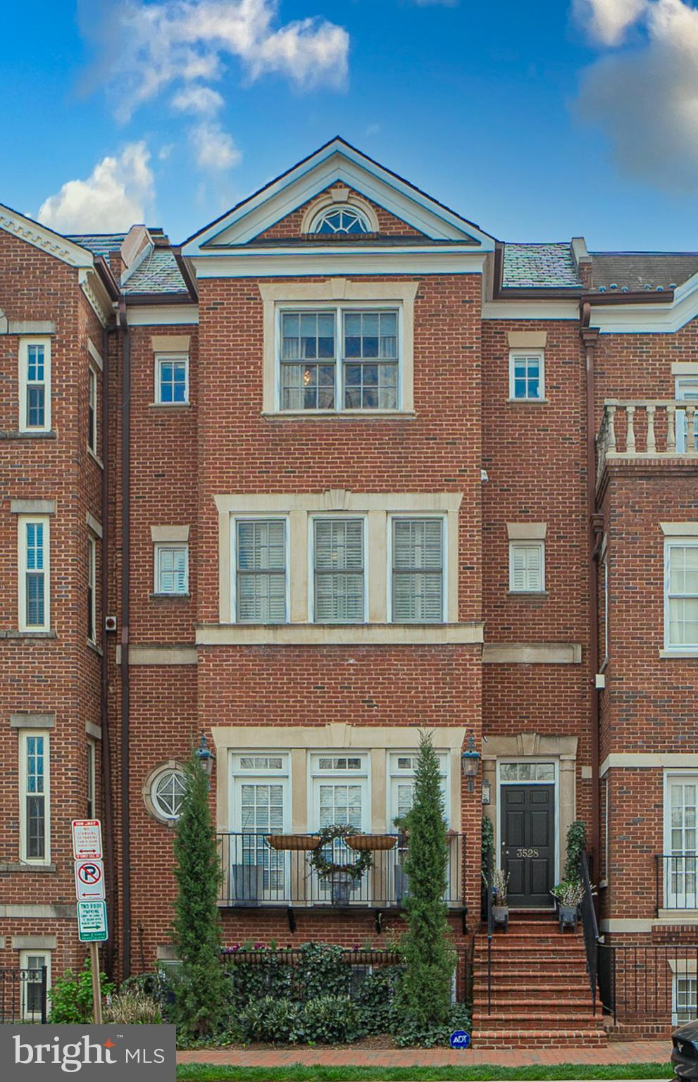 Introducing a luxurious and unique property for sale at 3528 Reservoir Rd NW, Washington DC. This expansive home spans an impressive 3,800 square feet.   Constructed by Ellis Denning Properties and designed by Studio Z, this townhome is the the WIDEST and NEWEST construction in the subdivision, as others were built in the late 1980's.  Future homeowners will benefit from a range of amenities including restaurants, shopping, parks, premium medical care just a short walk away, and cultural attractions.  Only a two block walk to Wisconsin Avenue and the heart of Georgetown!

Built in 2004 with detailed moldings and over 9 ft. ceilings, this house features a broad 25-foot width construction that adds to its welcoming, brick facade. Inside you'll find five bedrooms and four bathrooms spread across multiple levels offering ample space and privacy for every occupant.

The main level boasts an eat-in kitchen which leads out onto a large deck - perfect for al fresco dining or morning coffee amidst fresh air. The kitchen itself is spacious enough for comfortable meal preparations. Also on the main floor are separate foyer, large living and dining room, and powder room.

One floor up is the primary suite; an exclusive retreat designed with your comfort in mind.  Enjoy the large steam shower, two vanities, separate bathtub, and two separate toilets.  The third level houses three more bedrooms accompanied by two full bathrooms providing plenty of room for guests or additional residents.

The lower level reveals another bedroom complete with a full bathroom. Also featured on this level is a recreation room fitted with heated flooring and a gas fireplace- ideal for entertainment during cooler months. Wine connoisseurs will appreciate the conditioned wine room available here as well.

High ceilings throughout the home create an airy atmosphere while hardwood flooring adds warmth and elegance to each room. The walk-out lower level opens up to a rear patio where one can enjoy some outdoor relaxation time. Parking won't be an issue either with space for up to three cars available! 

This property embodies sophistication and convenience combined in one address – truly an exceptional offering in Washington DC's real estate market!