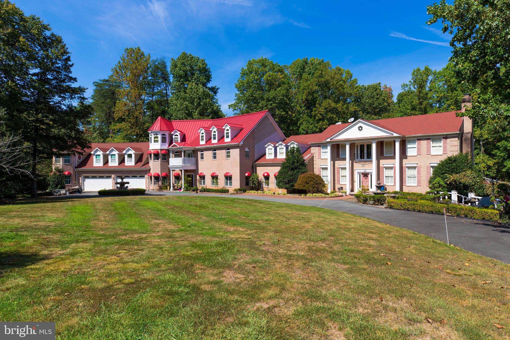Nestled on a sprawling 5 acres of privacy, this elegant generational estate offers endless potential in Fairfax Station!  A grand foyer with soaring 10' ceilings and a curved staircase welcome you to this magnificent home; quality details include hardwood floors throughout, gourmet chef's kitchen, heated in-ground pool and gazebo, formal library with beautiful built-ins, and owner's suite with fireplace and a sitting room.  This home can fit 100 cars in the driveway and has showcased weddings and large events with over a several hundred people. 

The fully-finished walk-out lower level features an expansive rec. room, and full bath that offers options for accommodating any lifestyle. Stay tuned for more details on this perfect blend of classic charm and modern comfort!

This property boasts a vineyard, walking trail, pool with pool house, and a large driveway.