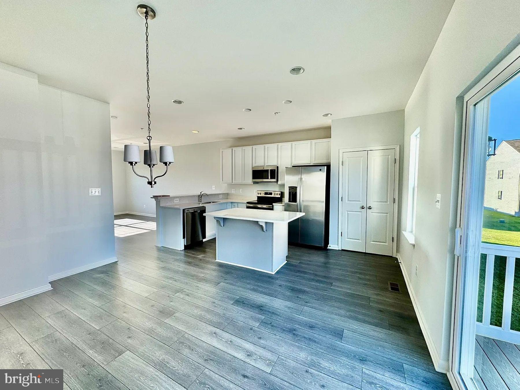 Step into luxury with this beautifully upgraded end-unit model townhome loaded with builder upgrades. This home features 1826 sq ft with 3 spacious bedrooms , 2 full baths, main level half bath , a lower level finished rec room with fireplace, half bath and 1 car attached garage. The main level open concept living area, kitchen and dining area are filled with natural light. The modern kitchen has ample cabinetry, an island and a two-door pantry for plenty of storage. This home is equipped with window treatments, energy-efficient windows, smart thermostats and LED lighting to minimize utility costs while enhancing comfort. Enjoy the peaceful pond views from the back deck.