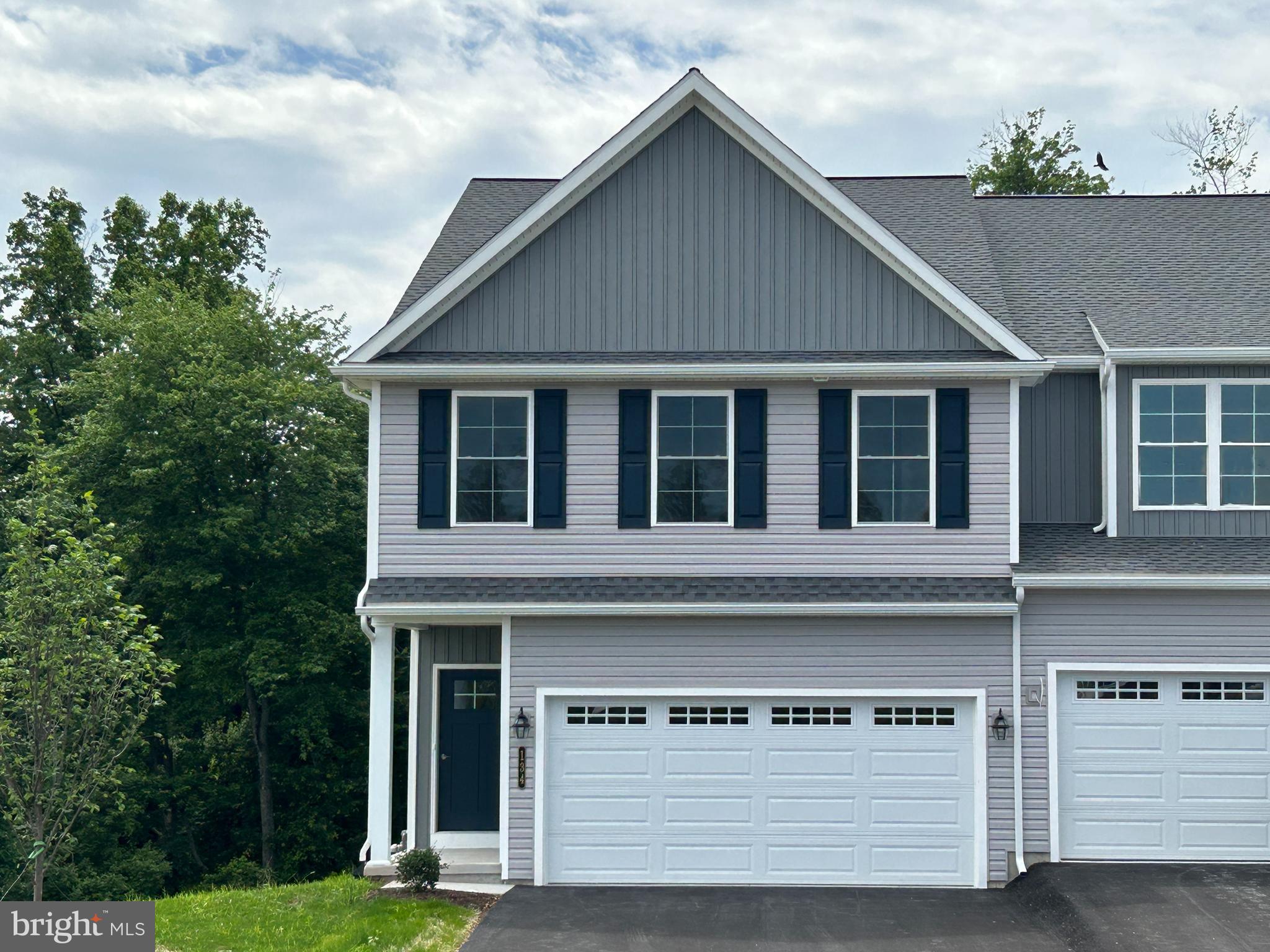 * $10,000 Builder Incentive offered on all townhomes; thru 6/15/26. * 
READY NOW. This Pheasant model is a 3 BD, 2.5 BA, 1,895 sq. foot, end unit townhome. With its nine foot ceilings and open foyer, well-lit, spacious and open first floor, this home exudes elegance. Included in this kitchen is an island, granite countertops, stainless steel appliances, recessed lighting, an adjacent pantry and many more features. You will feel right at home in the owner’s suite with its large spaces and lots of natural light. The owner’s bath and walk-in closet are exceptionally spacious. Also on the second floor are a loft, bedrooms two and three, a family bath and the laundry room, which is just steps from all bedrooms and bathrooms. This home features a full lower level, a 10'x12' concrete patio, and a 2 car garage. A side porch affords additional outdoor living space. The wooded area behind this home offers privacy and will be a nature-lover’s delight.

- All taxes are estimated as this is new construction and has not been assessed.
