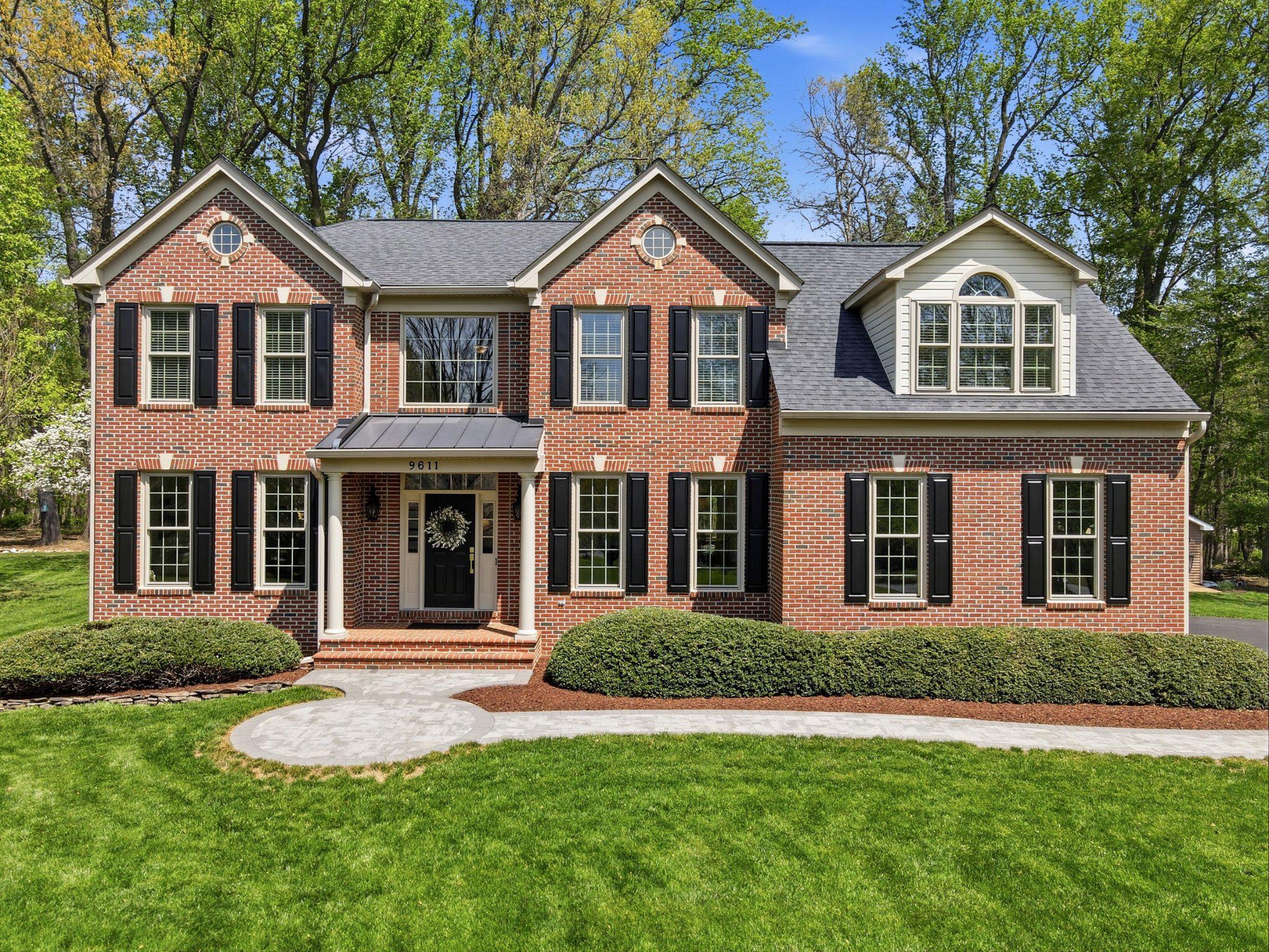 Welcome to this exquisitely appointed home, featuring stunning updates throughout and enhanced by valuable long-term warranties for added peace of mind. 

Nestled on a picturesque lot surrounded by mature trees and lush landscaping, this exquisitely updated home blends timeless design, thoughtful craftsmanship, and exceptional indoor-outdoor living. Step inside to a beautifully designed main level showcasing a grand living room anchored by a striking stone gas fireplace, creating a warm and inviting focal point. Additional spaces include a distinguished piano room, a private office, and a formal dining room that flows seamlessly into the newly renovated kitchen. The kitchen features brand-new finishes, including updated countertops, cabinetry, and appliances, all complemented by an active service contract for continued care and maintenance. 
A well-appointed main-level bedroom suite, complete with a walk-in closet and full bath, provides an ideal setup for guests or multi-generational living. Fresh, neutral paint, along with white oak flooring, adds a cohesive, modern feel throughout. The laundry room has also been redesigned to enhance both functionality and style. 

Upstairs, the expansive primary suite serves as a true retreat, highlighted by a beautifully remodeled primary bathroom and a relaxing sitting area. Additional upper-level bedrooms feature new carpeting, accompanied by updated bathrooms that offer both comfort and style. The flex room/office can easily be converted to another bedroom!
The fully finished walk-up lower level expands the home’s living space, featuring a beautifully designed full bath with a deep-soaking tub, perfect for unwinding. A dedicated storage rack system adds convenience and organization. 
Outdoors, the home continues to impress with a brand-new resurfaced driveway, a low maintenance Trex deck, and an elegant stone patio that opens to an expansive yard, ideal for entertaining or quiet enjoyment. The tree-lined homesite backing to tranquil woods provides a rare sense of privacy. The owners have even created a lovely private nature path you will love for years to come. A spacious two-car attached garage completes the home. 

Significant value-added features include a 40-year roof warranty, a lifetime transferable warranty on the windows, and a service contract on the kitchen appliances, offering both luxury and confidence in ownership. 

Major updates include: Kitchen renovation (2025), remodeled primary bathroom (2026), driveway resurfacing (2026), updated laundry room (2025), Trex deck (2023), stone patio (2023), windows (2021), HVAC (2020), and water heater (2020). Don’t miss the opportunity to own this exceptional home!
