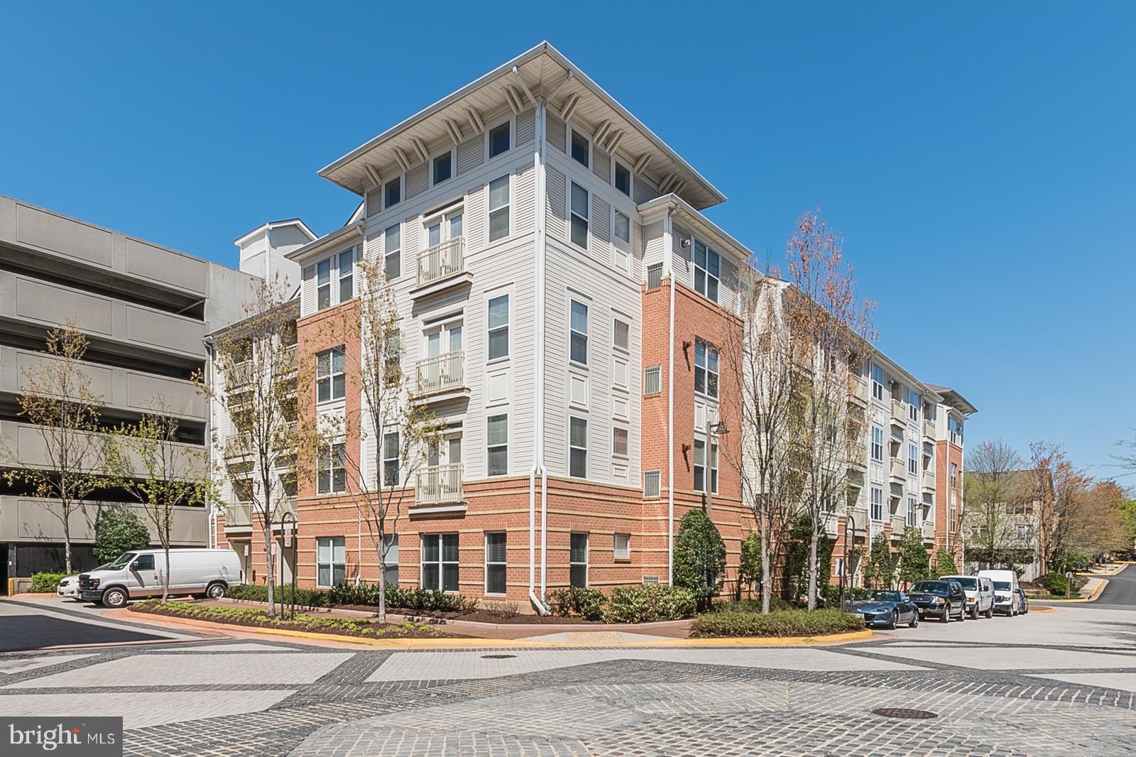 Welcome home to The Marquis at Vienna Station—where convenience, comfort, and exceptional amenities come together. Located directly across from the Vienna/Fairfax–GMU Metro Station on the Orange Line, this home is truly a commuter’s dream. This inviting 1-bedroom, 1-bath condo offers a bright and functional layout with a spacious living room featuring a cozy gas fireplace and ceiling fan. The generously sized bedroom is filled with natural light and includes a walk-in closet, while the bathroom offers ample counter space and a tub/shower combination. The dedicated garage parking space (G4-348) is conveniently located on the same level as the unit and just steps from the building entrance, providing easy everyday access. Residents enjoy access to an impressive collection of resort-style amenities, including a basketball court, golf simulator, billiards room, business center, fitness center, theater room, community lounge overlooking the basketball court, outdoor grilling areas, and a sparkling swimming pool. Ideally situated just minutes from the Town of Vienna, approximately 3 miles from the vibrant Mosaic District, and about 5 miles from Tysons Corner, this location offers endless options for shopping, dining, entertainment, and recreation.