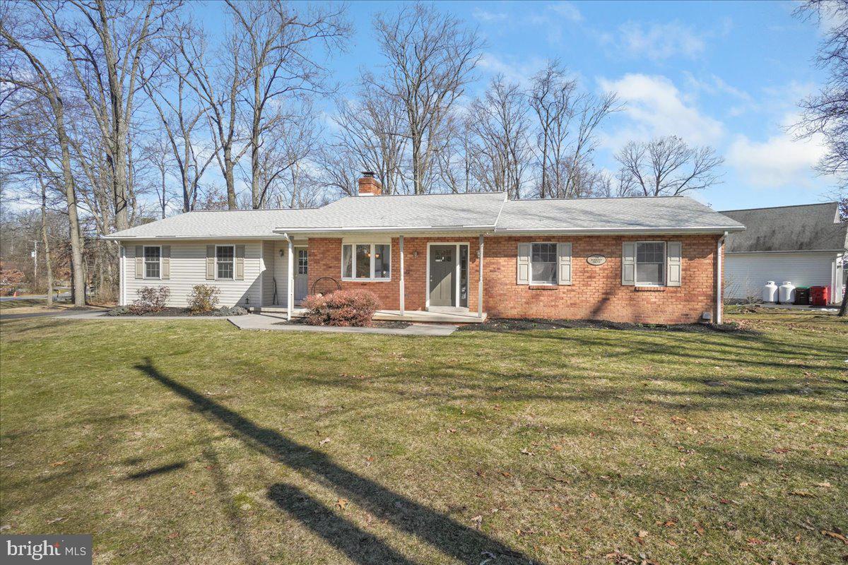 This beautifully well maintained rancher sits on a generously sized corner lot in Lake Heritage. This home offers an open floor plan. The wood burning fireplace can be felt throughout the main level. Right off the kitchen/dining area is a deck for entertaining.  Out back there is a great paver patio with a fire pit for roasting marshmallows on those cool evenings The over sized garage holds two cars and much more. Sellers have painted the whole house and replaced carpets in all 3 bedrooms. The unfinished basement awaits your finishing touches. Deck is being painted.