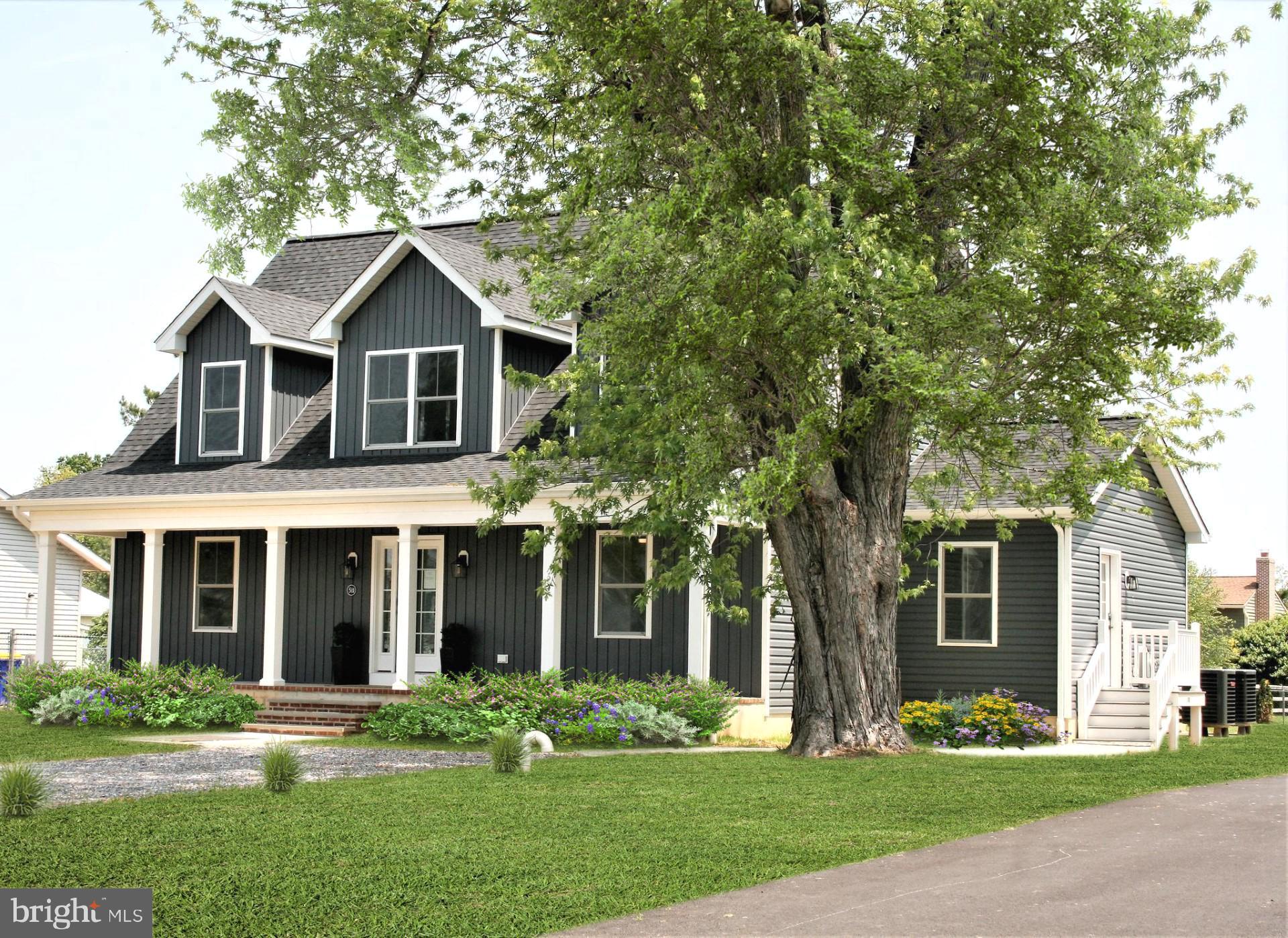 Nestled in the picturesque coastal community of Bay City, this newly constructed Cape Cod-style residence is a true gem. Offering partial water views of the serene Chesapeake Bay and the iconic Bay Bridge, this home is a haven of luxury and comfort. As you step inside, you'll be greeted by an open-concept main level that seamlessly connects the living spaces, making it perfect for hosting gatherings. The heart of the home is undoubtedly the custom kitchen, a culinary enthusiast's dream, complete with a large island, gleaming quartz countertops, lighted glass-front accent cabinets, and elegant pendant lighting. The kitchen's stainless steel appliances are complemented by recessed lighting that graces the entire house, creating a bright and inviting atmosphere.
Rich Oak hardwood floors from Danzco Hardwood Flooring adorn all the main living areas, adding a touch of sophistication and warmth to the home. This property boasts not one but two master bedroom suites, each featuring en-suite bathrooms with Quartz countertops and custom tile work. The lower-level master bathroom even includes the added luxury of heated floors, ensuring comfort during the colder months. With a total of four spacious bedrooms and three and a half bathrooms, this home provides ample space and privacy for families and guests alike.
Outside, an oversized detached garage awaits, offering a second level for storage or a versatile work area. For added convenience, there's an option to install a secondary driveway to the garage, providing even more flexibility for the new homeowner. The community of Bay City also offers an array of amenities just steps away, including a beautiful beach, pier, and pavilion, perfect for enjoying the natural beauty of the surroundings and fostering a sense of community.
Bay City's prime location, just a two-minute drive from the Bay Bridge, ensures easy access to neighboring areas, making this home ideal for those who need to commute or simply want to explore nearby attractions. In addition, the property will soon feature a new garage door, adding the finishing touch to this exquisite residence. With public water and sewer services in place, this home offers both luxury and convenience in a coastal paradise. Don't miss your chance to experience the coastal charm and modern elegance of this stunning Cape Cod home in Bay City—schedule your viewing today and make it your own.