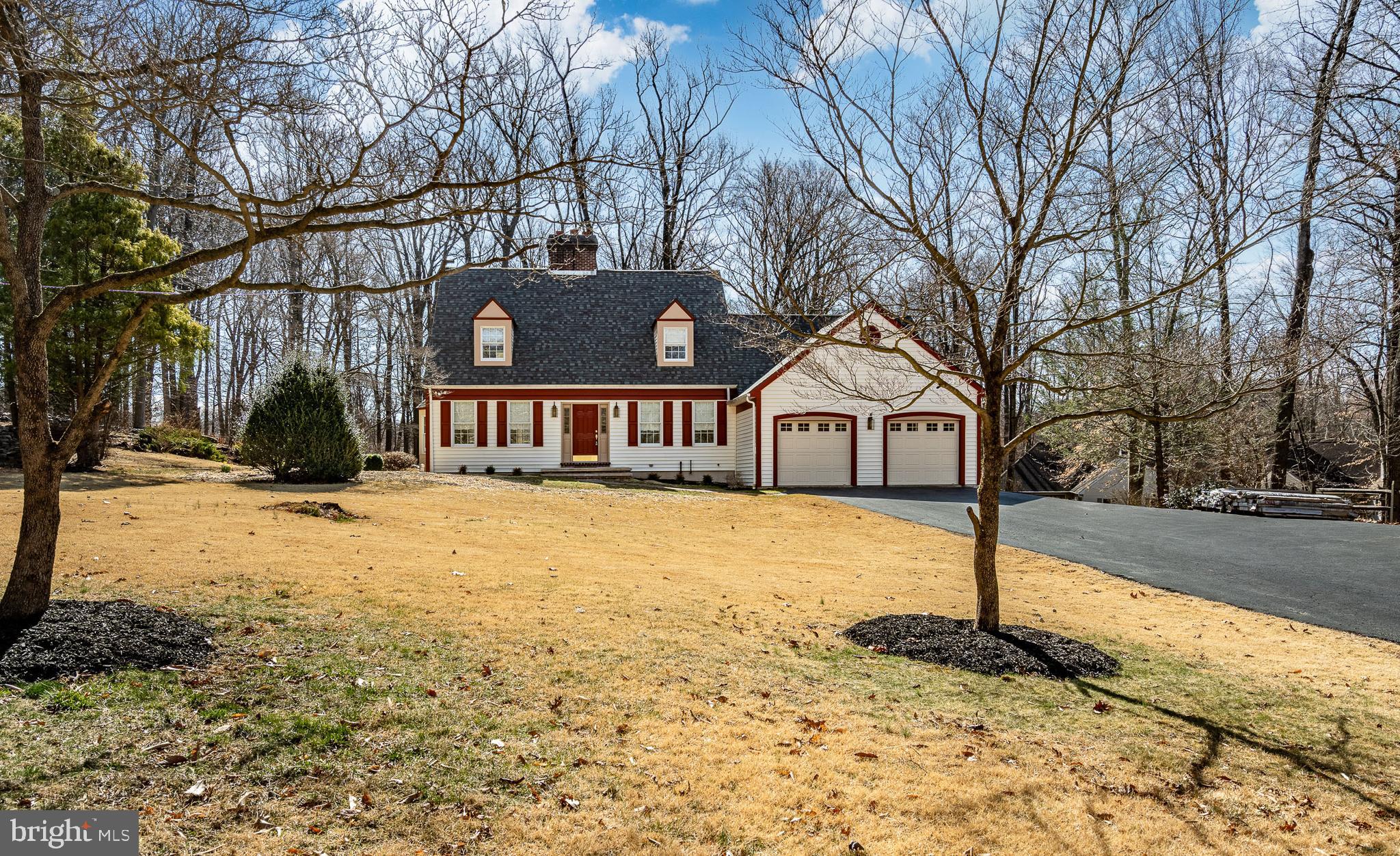 Welcome to this charming 3-bedroom, 2.5- bath home nestled on 2.5 acres. This home is a rare opportunity for those seeking space and privacy. As you enter the home on your right you will find a very bright dining room, on the left the spacious living area features a large picture window that lets plenty of natural light. The living room also features a wood burning fireplace. Beautiful glass door leads right into a charming sunroom. The kitchen has a second brick wood burning fireplace with hardwood floor.  The laundry area is large and has cabinets for storage and a walk-in shower can be used for a doggie shower. Upstairs you will find the main bedroom with 2 closets and full bath with double sinks. Two more well-proportioned bedrooms share a sizable hall bath. In addition to the full unfinished basement, you have 2 car attached garage a large composite deck with a gazebo. The expansive backyard is ideal for outdoor entertaining or simply enjoying the peaceful surroundings. Fresh paint and new carpeting round out this amazing home. Located just minutes from school, parks, shopping and dining, this home is a perfect combination of quiet suburban living with easy access to all amenities you need. Don't miss the chance to make this home your own!